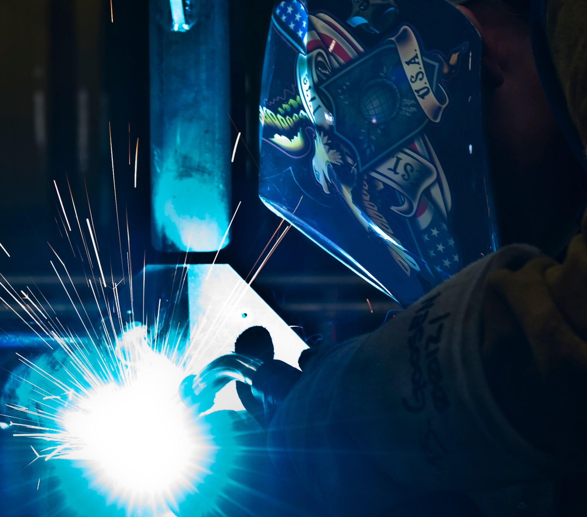 U.S. Air Force Airman 1st Class Brooke Goosen, 7th Equipment Maintenance Squadron, welds a Y-stand for holding munitions Aug. 14, 2012, at Dyess Air Force Base, Texas.  Goosen is the only female out of 28 Airmen in the Dyess metal shop and has more than seven years experience with welding. (U.S. Air Force photo by Airman 1st Class Jonathan Stefanko/ Released)