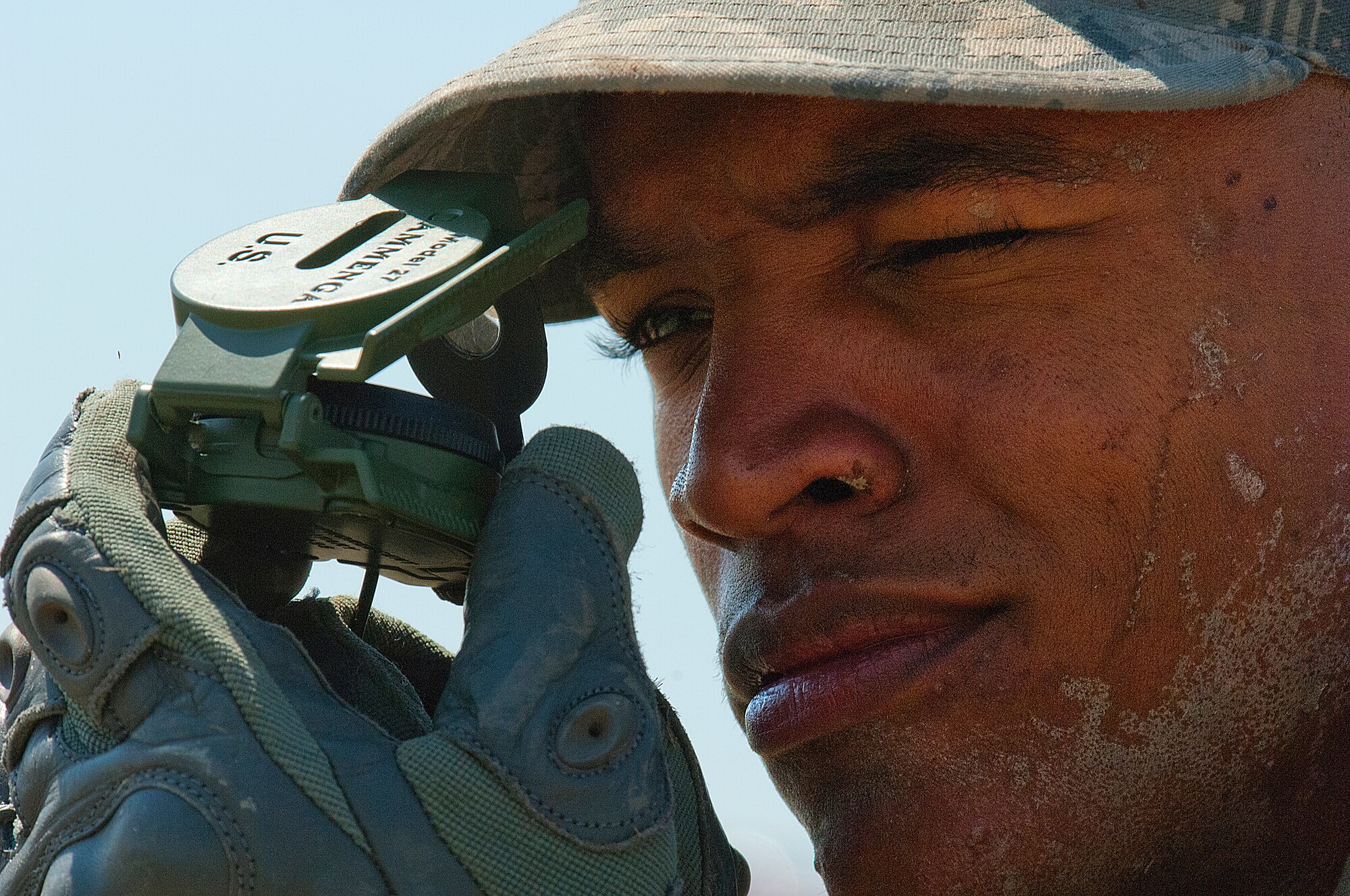 Airman 1st Class Duane Funderburk, 790th Missile Security Forces Squadron, takes a directional siting with a Modal 27 compass during Crow Creek Challenge Aug. 10. Funderburk was part of the 790th MSFS Response Force One team in the annual F. E. Warren Air Force Base, Wyo., competition. (U.S. Air Force photo by R.J. Oriez) 