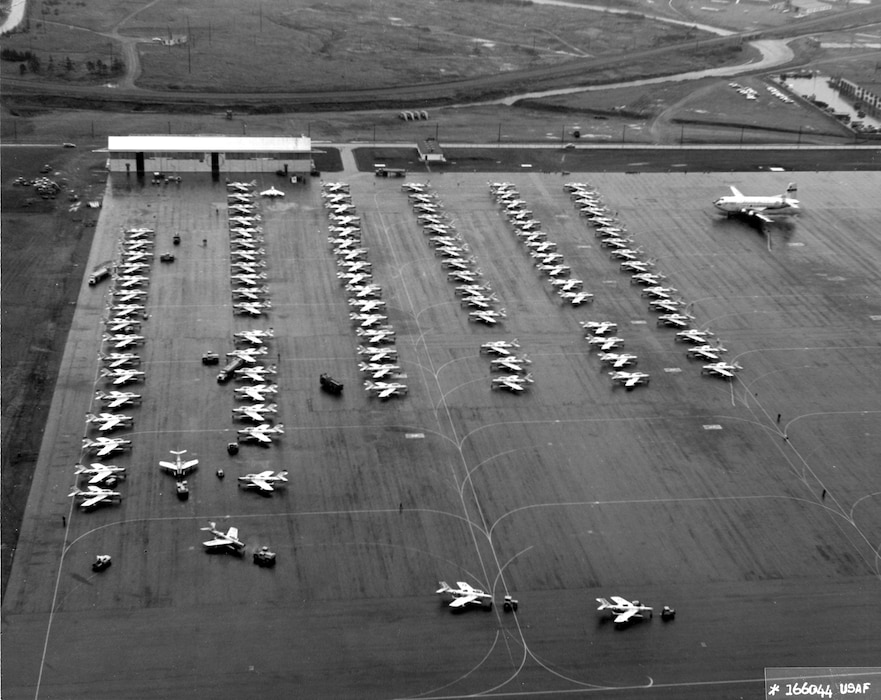 F-84Fs of the Federalized Air National Guard in Newfoundland, November 1961, prior to flying the Atlantic to Europe in response to the Berlin Crisis. Because of the long over-water distance to the next airfield in the Azores, the planes were towed to the end of the runway prior to takeoff to conserve fuel. During this Operation Stair Step deployment of more than 200 fighter aircraft (the largest overseas movement of a fighter force since World War II), not a single plane was lost. (U.S. Air Force photo)