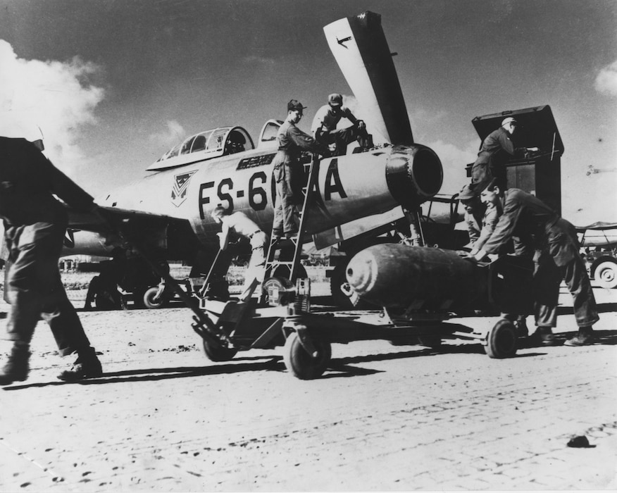 Ground crew prepares an F-84 from the Florida ANG’s 159th Fighter Squadron for a combat mission during the Korean War. Unit was temporarily based in South Korea.