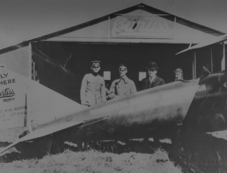 Captain (later Brig. Gen.) Raymond S. Miller (far left) prepares to fly from St. Paul, Minn., to Washington, D.C., with plans for the first air unit of the postwar National Guard, 20 September 1920. Miller is pictured with (left to right) Brig. Gen. Walter F. Rinow, Minnesota’s Adjutant General; Governor J.A.A. Bergquist; and Lt. Col. William C. Garis, Assistant Adjutant General. (NGB Historical Services Collection)