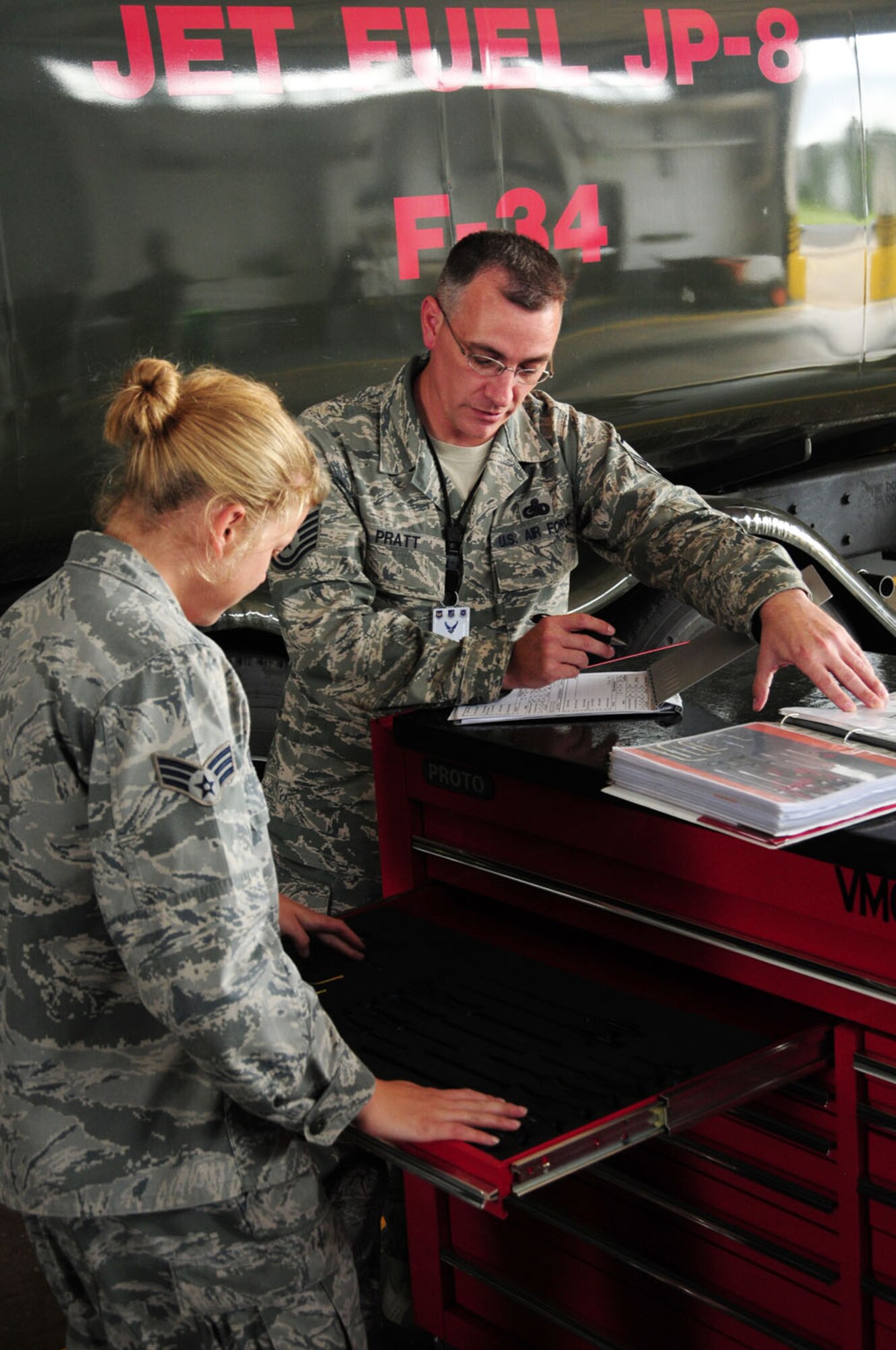 RAF MILDENHALL, England – Senior Airman Ashley Turnage, 100th Logistics Readiness Squadron refueling maintainer, goes through a tool inventory as Master Sgt. Brian Pratt, a Logistics Compliance Assessment Program inspector from Ramstein Air Base, Germany, assesses her Aug. 16, 2012, in Bldg 725, RAF Mildenhall. The 100th LRS, 100th Maintenance Group and 727th Air Mobility Squadron have been undergoing an LCAP inspection since Aug. 13. (U.S. Air Force photo/Karen Abeyasekere)