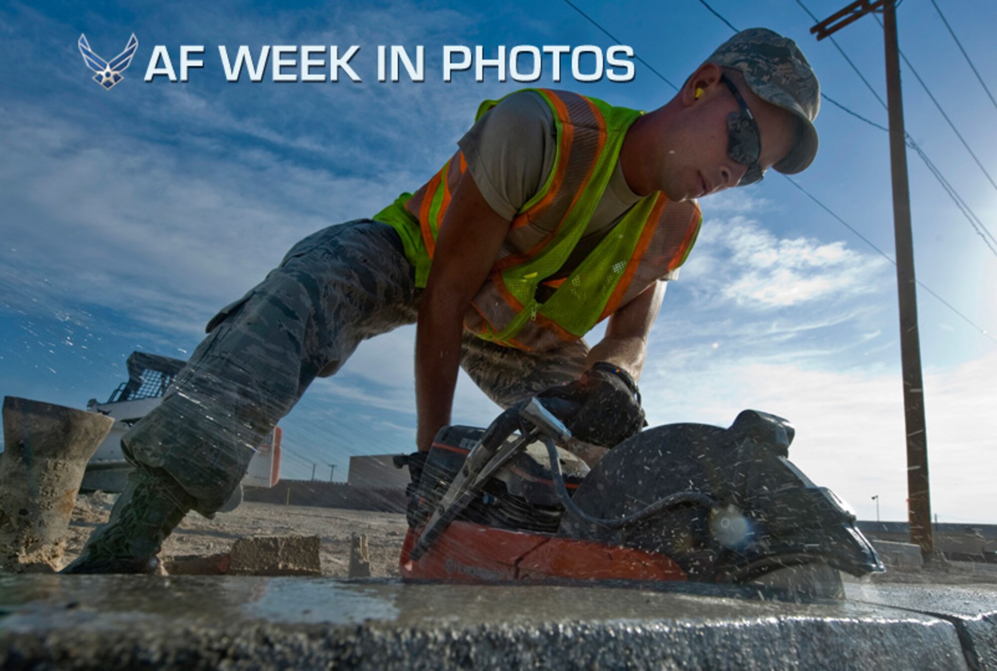 Senior Airman Andrew Higginbotham uses a concrete saw to cut out a piece of curb during the construction of a parking lot at Nellis Air Force Base, Nev., Aug.15, 2012. The parking lot will be a general parking lot for work centers around the area. Higginbotham is a 99th Civil Engineer Squadron heavy equipment and pavements journeyman. (U.S. Air Force photo/Airman 1st Class Daniel Hughes)