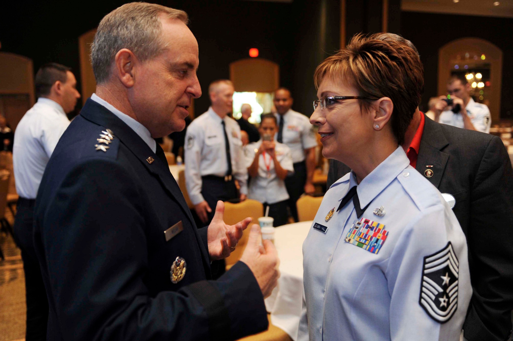 Air Force Chief of Staff Gen. Mark A. Welsh III talks with Chief Master Sgt. Denise Jelinski-Hall after speaking at a senior leaders’ perspective during the Air Force Sergeants Association Professional Airmen's Conference Aug. 15, 2012, in Jacksonville, Fla. During his speech, Welsh emphasized the role leaders play in Airmen's lives, as well as the importance of leaders getting to know their Airmen. (U.S. Air Force photo by Staff Sgt. Ciara Wymbs)