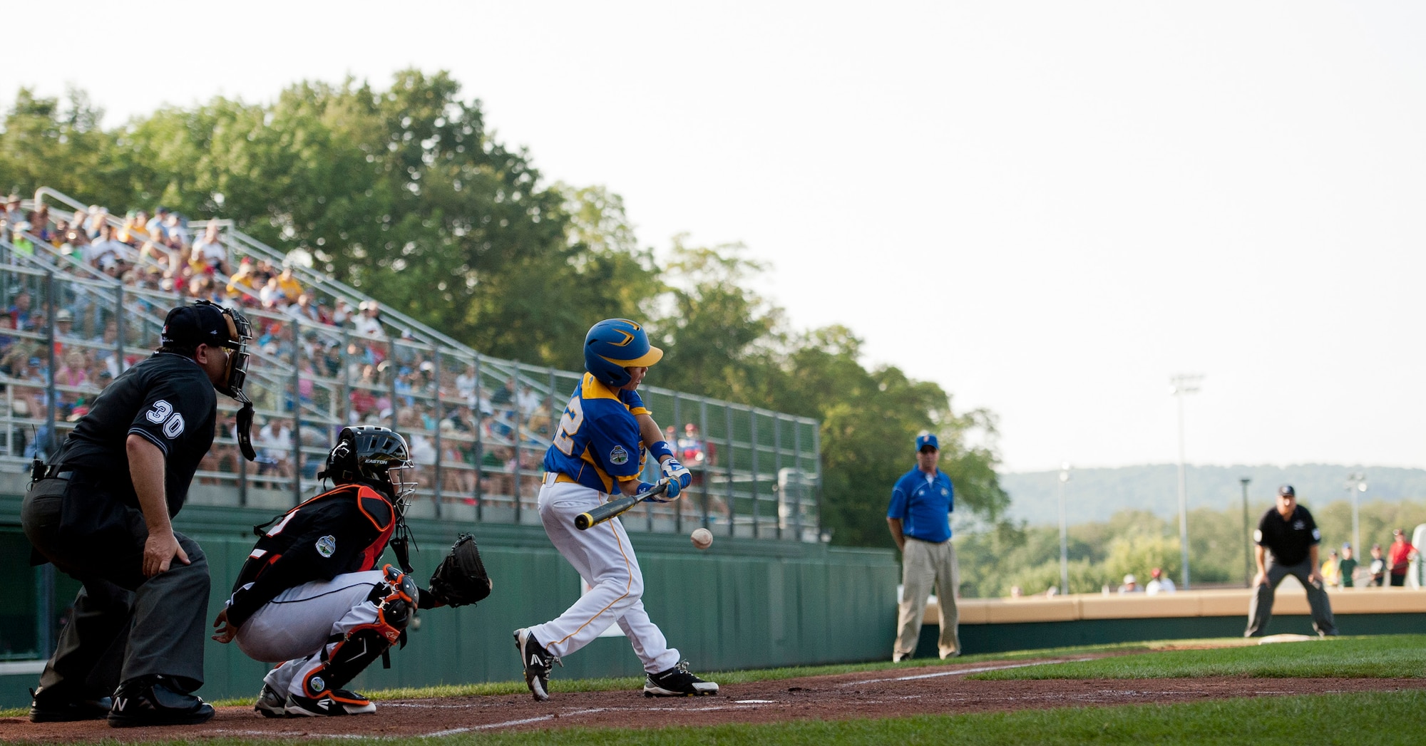 Tristan Waring swings at a ball in his first game of the 2012 Little League World Series held in South Williamsport, Pa., Aug. 16, 2012. Europe’s team is made of dependent of the Kaiserslautern Military Community in Germany to include Air Force, Army and Department of Defense members. (U.S. Air Force photo/Senior Airman Andrew J. Lee) 