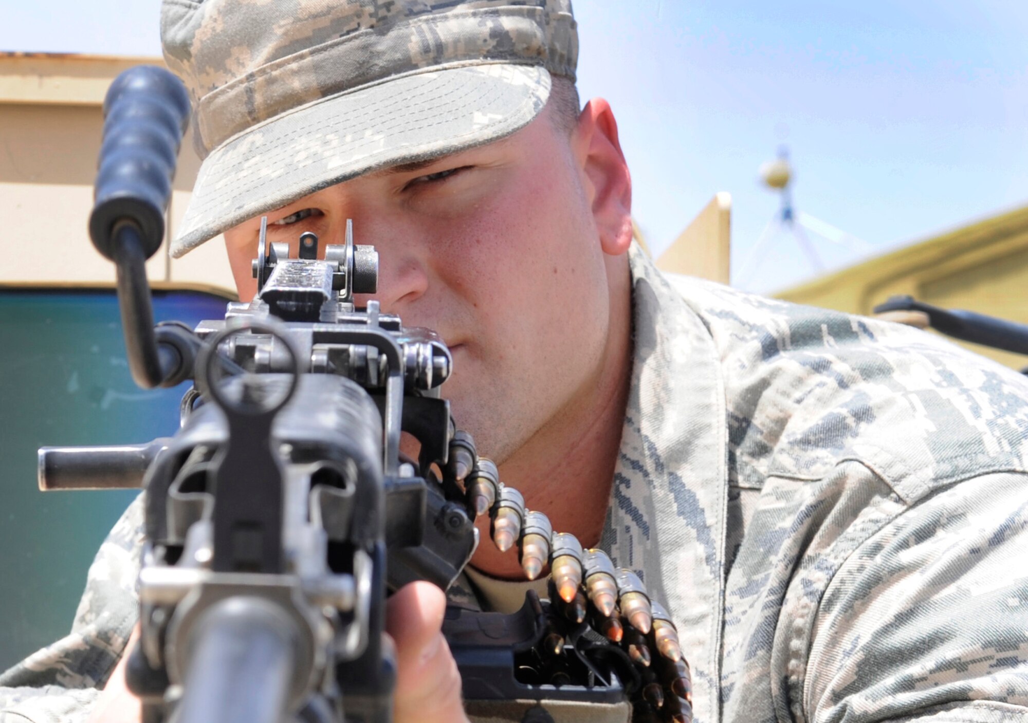 SOUTHWEST ASIA – Airman 1st Class Donald Moran, 387th Expeditionary Security Forces Squadron, is always ready with an M-240 machine gun. He is one of many Airmen who ensure only authorized personnel enter and exit the base, responds to alarms, search vehicles and provides perimeter security. Moran is the 386th Air Expeditionary Wing’s Rock Solid Warrior. (U.S. Air Force photo/Staff Sgt. Alexandra M. Boutte)