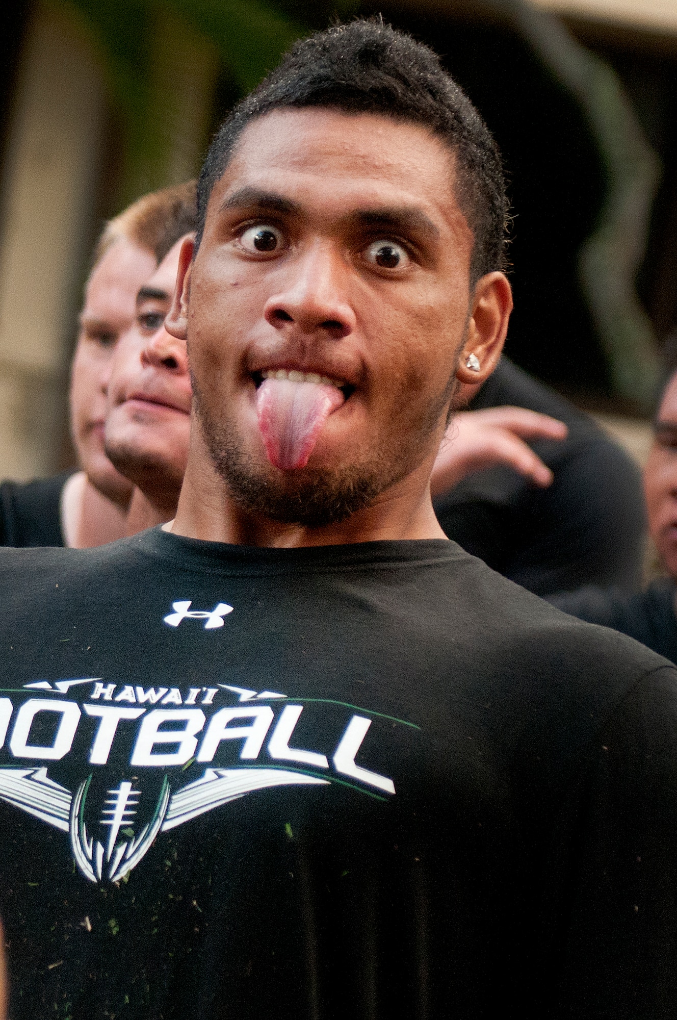University of Hawaii Warriors football team perform a haka for the Air Force and Navy members who gave them a early morning basic training style wake-up call Aug. 14 at Joint Base Pearl Harbor-Hickam.  Former Air Force and Navy basic military training instructors gave a very special wake-up call to the University of Hawaii football team shortly after 5 a.m. for a team building exercise. (U.S. Air Force photo/Staff Sgt. Mike Meares)