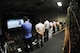 Members from the Gunsan City Police Department wait for final scores after firing an M9 handgun simulator weapon toward a digital screen on Kunsan Air Base, Republic of Korea, Aug. 10, 2012. Members from the GCPD were given a demonstration and tour of a firearms training simulator, which many defenders across the military use to train. (U.S. Air Force photo/Senior Airman Jessica Hines)