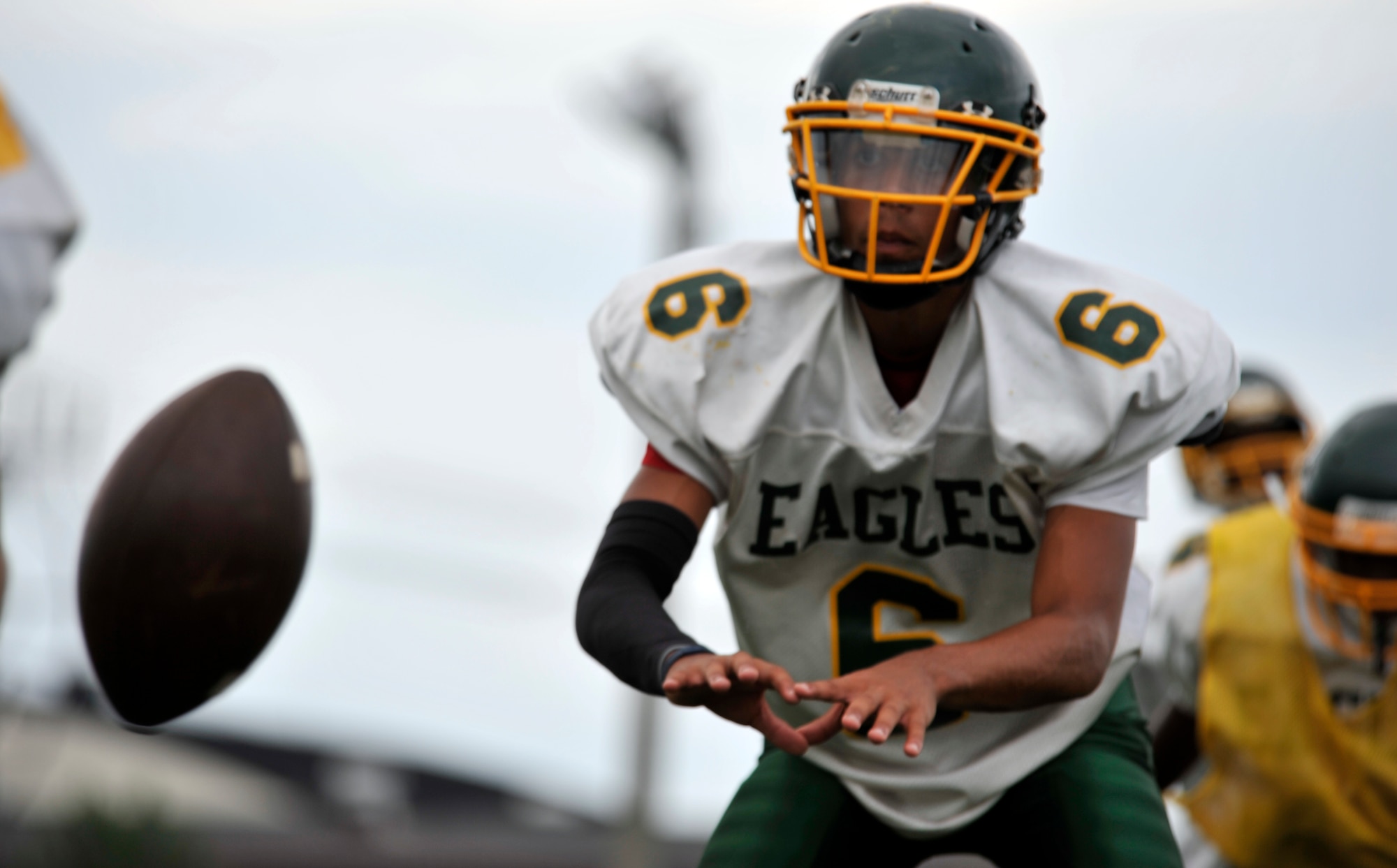 Edgren Eagles quarterback Tristan Jefferson awaits the snap from his center during Edgren High School’s football practice at Misawa Air Base, Japan, Aug. 15, 2012. The team started offseason practices in June and is now in full pads. (U.S. Air Force photo by Airman 1st Class Zachary Kee/Released)