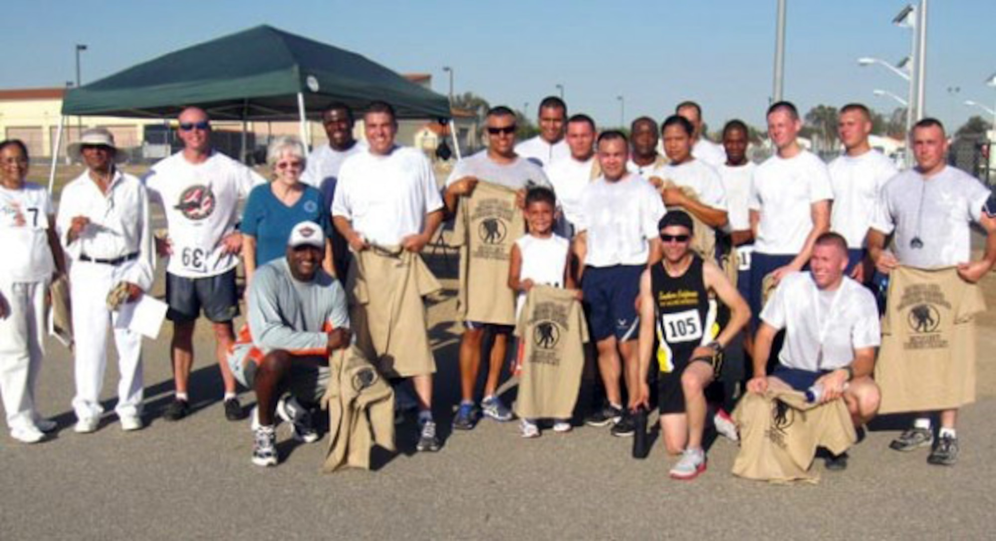 Winners and participants of the Wounded Warrior 5K/10K Run/Walk at the March Air Reserve Base Fit 2 Fight track, Aug. 7. Gabriel Mikles (front, center), son of Tech. Sgt Dana Mikles, 452nd Honor Guard ran the 5K run time 29:30. (U.S. Air Force photo)