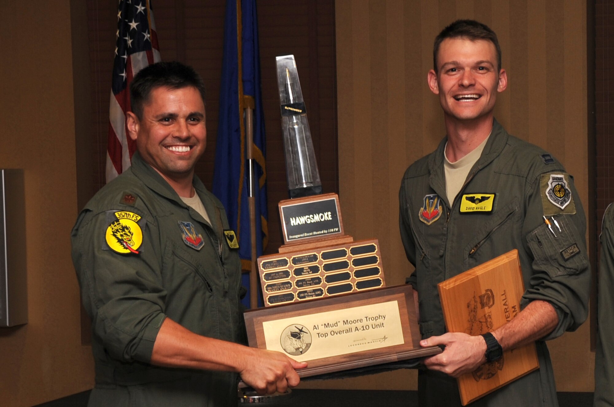 Maj. Matt Lackey and Capt. David Nagel, 357th Fighter Squadron from Davis-Monthan Air Force Base accept the Al “Mud” Moore Trophy for Top Overall A-10 unit during Hawgsmoke, Aug. 17, 2012. Hawgsmoke is an international biennial competition, with approximately 15 A-10 units competing. The host unit was Davis-Monthan Air Force Base, Ariz. (U.S. Air Force Photo by Staff Sgt. Lauren Padden/Released)
