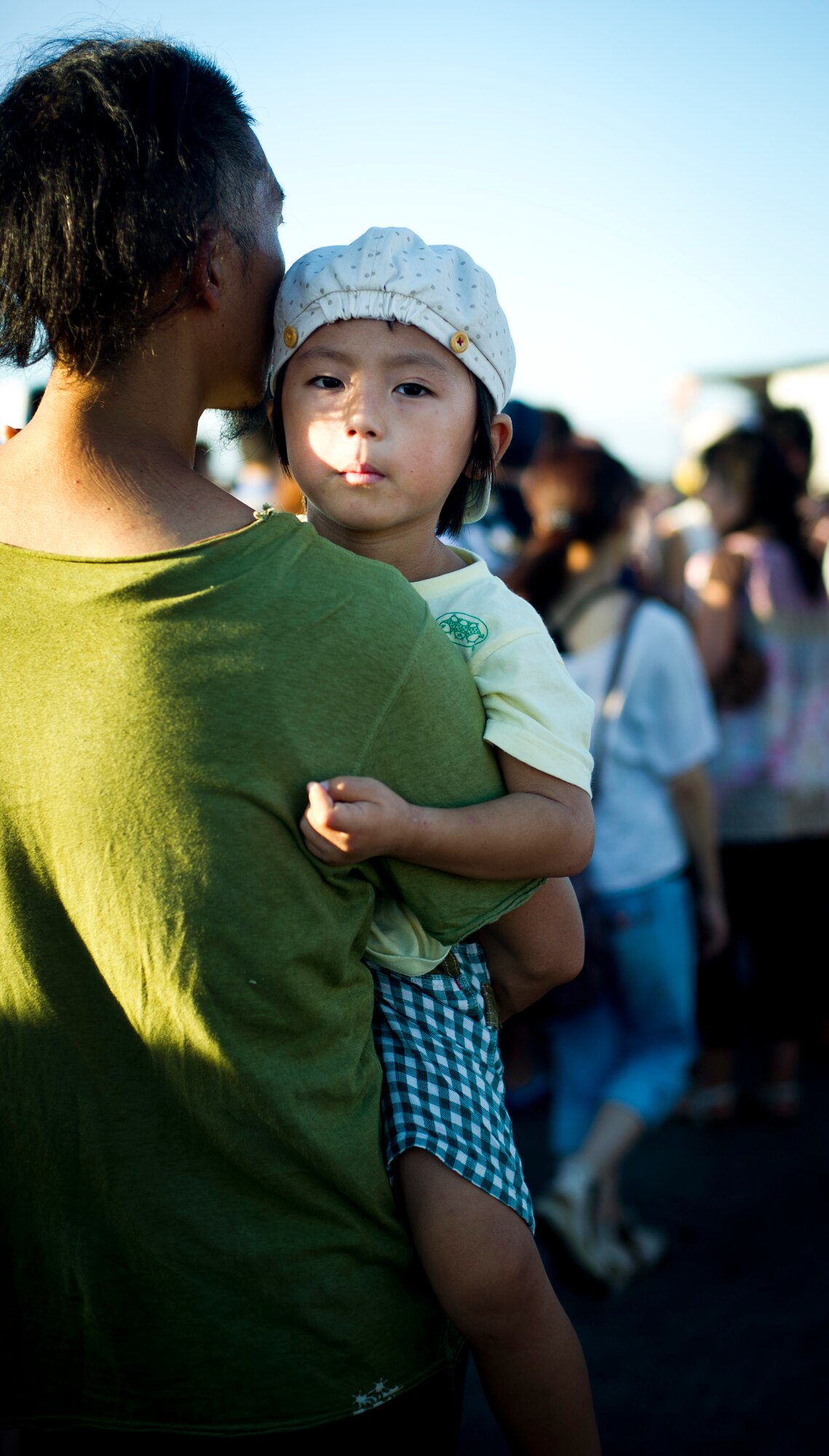 YOKOTA AIR BASE, Japan -- A Child is carried through the crowd at the 2012 Japanese-American Friendship Festival at Yokota Air Base, Japan, Aug 18, 2012. Approximately 175,000 visitors attended the two-day festival. (U.S. Air Force photo by Staff Sgt. Stacy Moless)