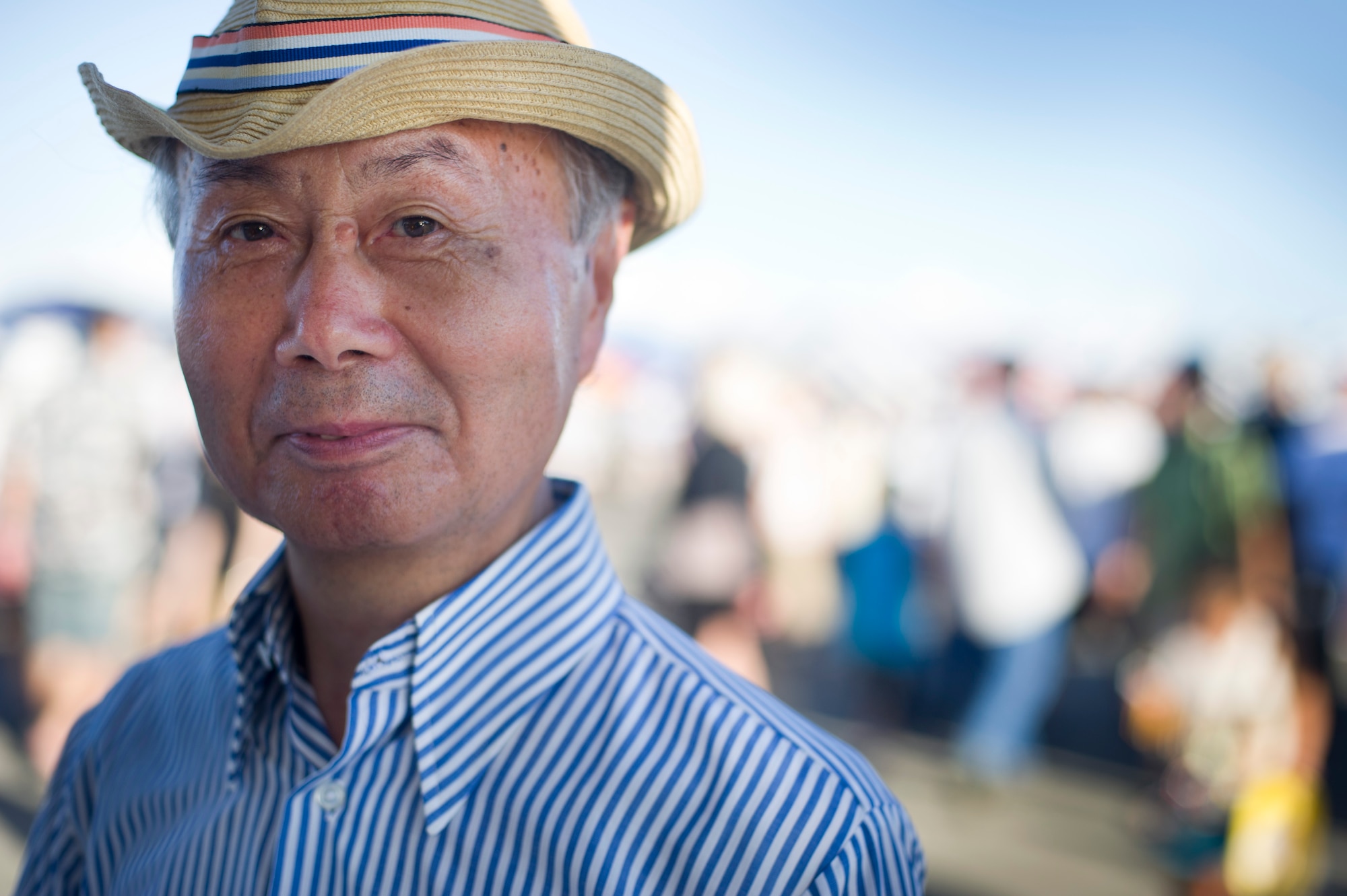 YOKOTA AIR BASE, Japan -- Miyagi Kobayashi stops at the information booth to get a flyer and talk to the volunteers at about his experience during the 2012 Japanese-American Friendship Festival at Yokota Air Base, Japan, Aug 18, 2012. Approximately 175,000 people from Yokota and the surrounding community came out for the festival. (U.S. Air Force photo by Staff Sgt. Stacy Moless)
