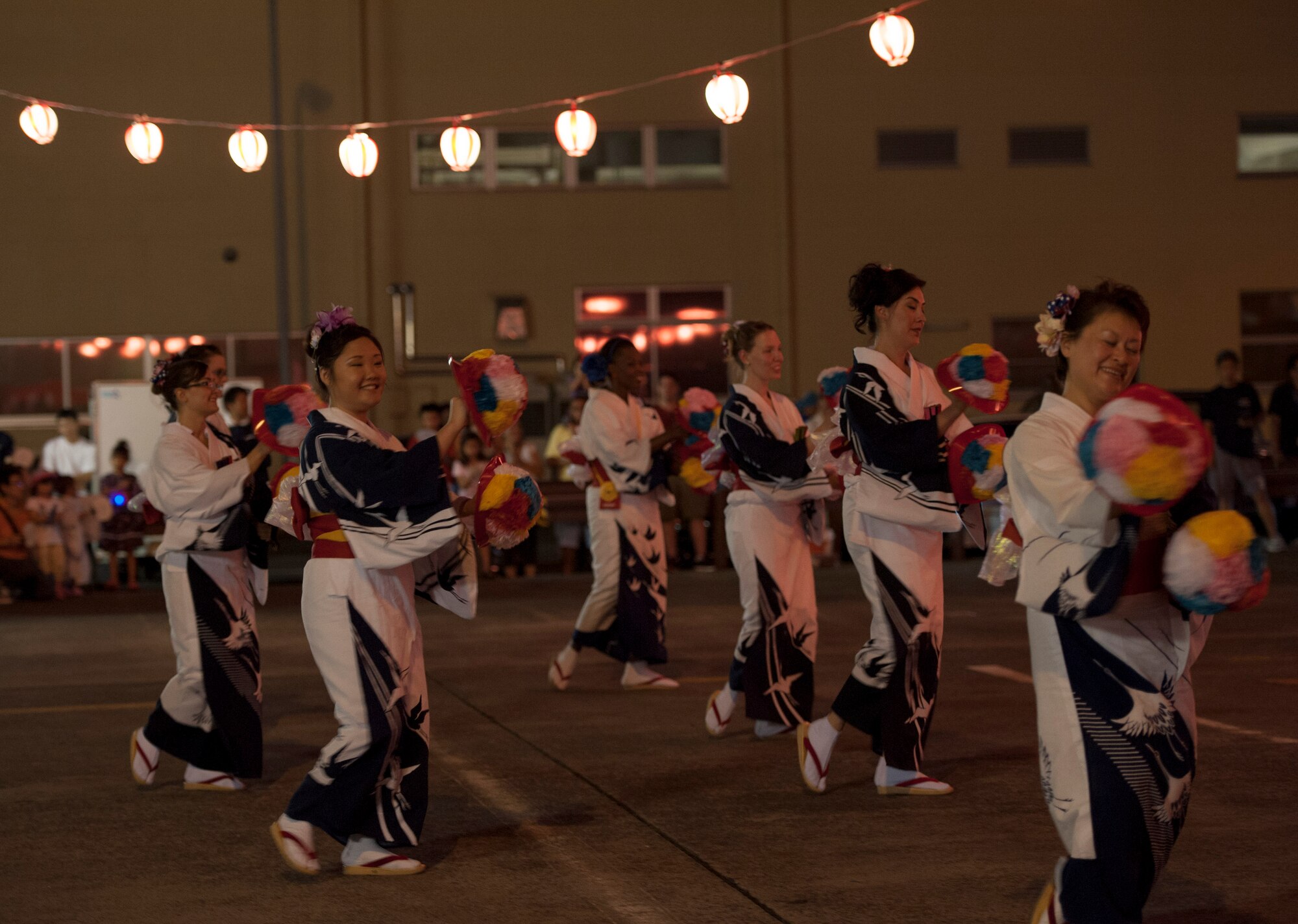 YOKOTA AIR BASE, Japan -- Yokota Air Base Tanabata Dancers perform Koi No Hanagasa, a tradition Japanese stage dance, during the 2012 Japanese- American Friendship Festival at Yokota Air Base, Japan, Aug. 18, 2012. The group was established in 1973 to promote goodwill and friendship with the Japanese by learning traditional dances and joining in Japanese festivals. (U.S. Air Force photo by Senior Airman Andrea Salazar)