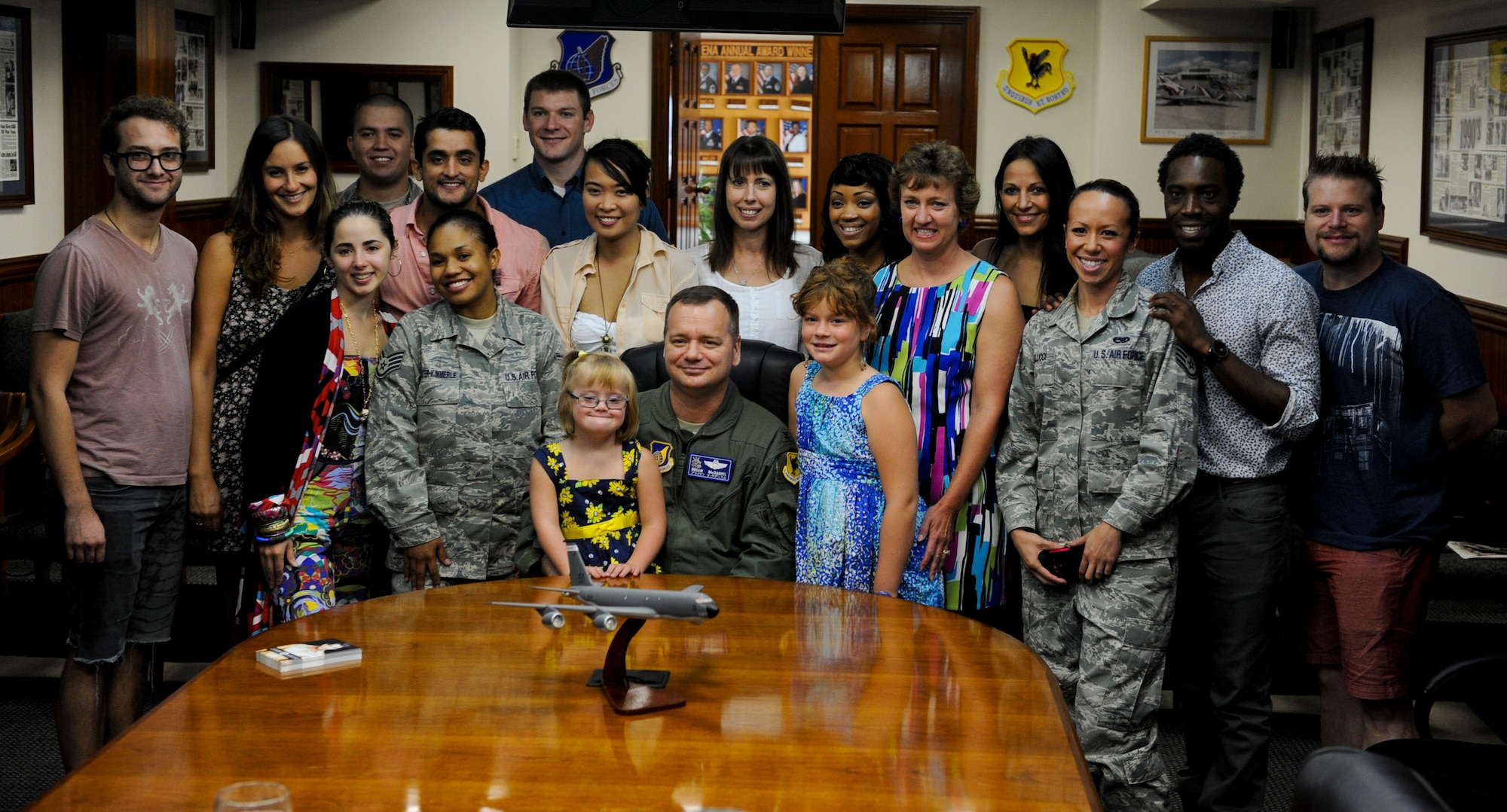 U.S. Air Force Col. Brian McDaniel, 18th Wing vice commander, poses for a photo with the former American Idol contestants, co-workers and his family during an Idol World Tour on Kadena Air Base, Japan, Aug. 17, 2012. The Idols World Tour brings U.S. troops and their families face-to-face with the stars they've seen on TV. (U.S. Air Force photo/Airman 1st Class Justin Veazie)