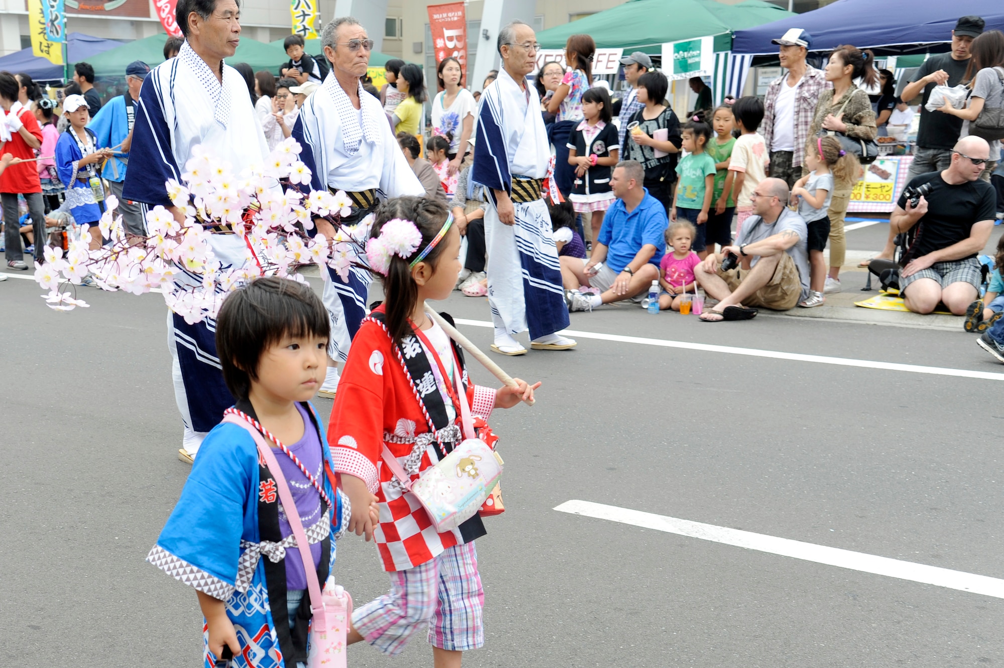 Misawa Air Base families line the streets of Misawa City to watch the parade at the start of the Misawa Summer Festival Aug. 19, 2011. This year, Misawa residents can watch the parade run in front of American Park outside the main gate Aug. 25. (U.S. Air Force photo/Tech. Sgt. Marie Brown)
