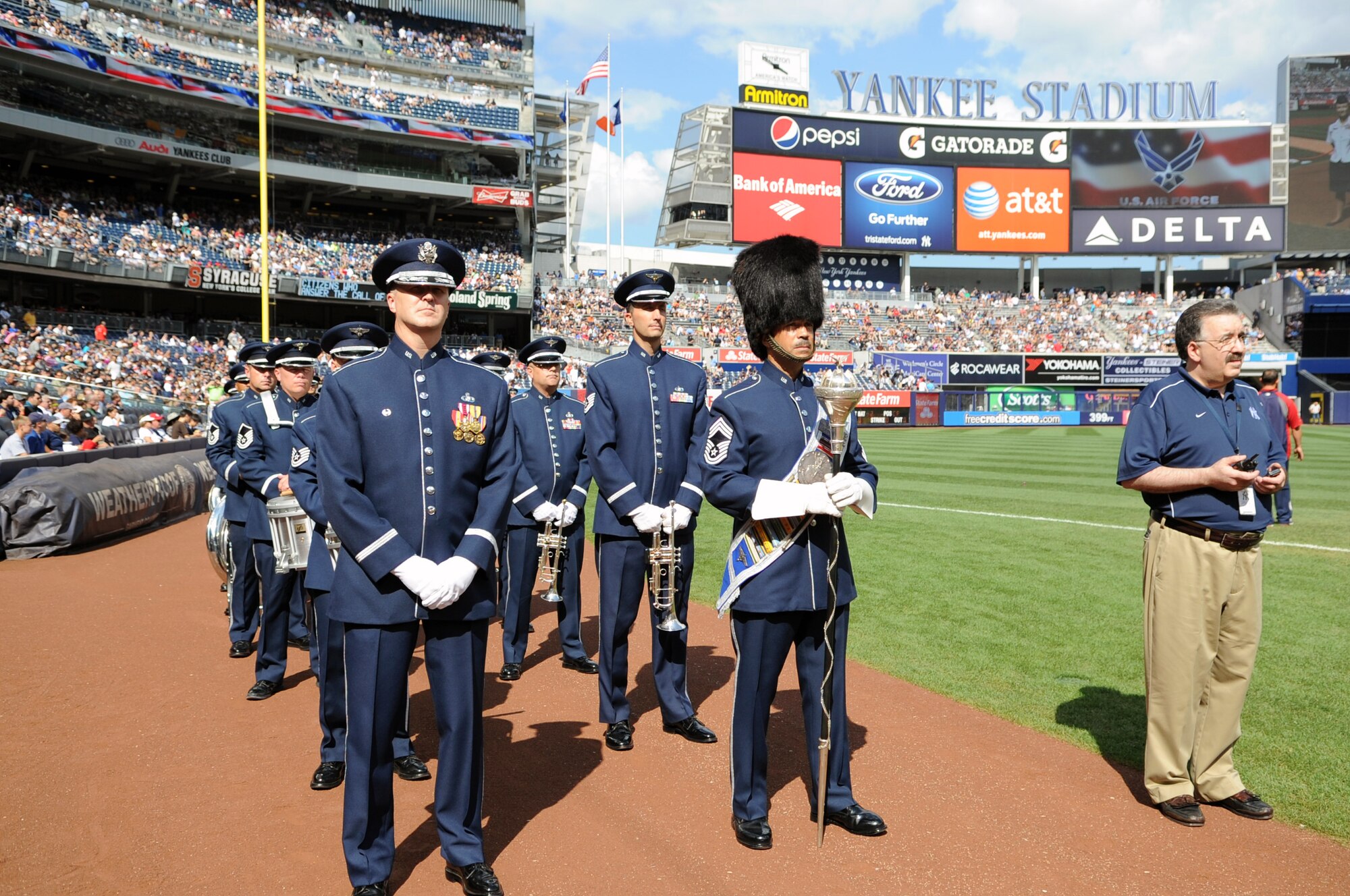 The U.S. Air Force Band and U.S. Air Force Honor Guard prepare to perform during the opening ceremony for the Yankees vs. Red Sox game Aug. 18 at the Yankee Stadium, Bronx, N.Y. The performance kicked off the ceremonial units’ participation in Air Force Week 2012. (U.S. Air Force photo by Senior Airman Tabitha N. Haynes) 
