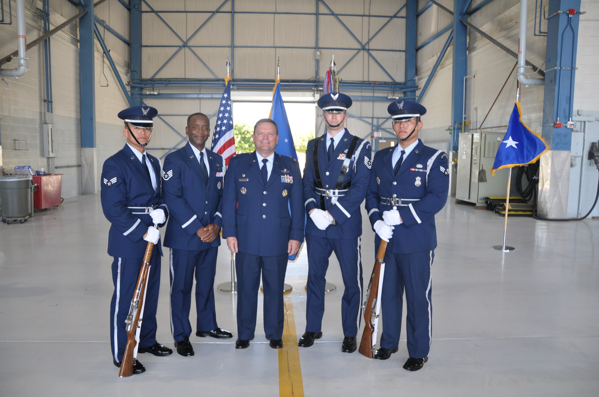 Col. Samuel C. Mahaney takes command of the 452nd Air Mobility Wing, March Air Reserve Base, Calif. from Major General Mark A. Kyle, commander, 4th Air Force on August 4. Airmen assigned to the Base Honor Guard present arms during the
base change of command ceremony. (U.S. Air Force photo by Senior Airman Isis Ponce)