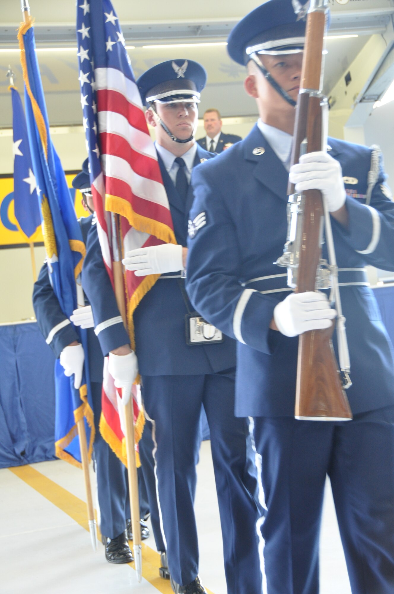 Col. Samuel C. Mahaney takes command of the 452nd Air Mobility Wing, March Air Reserve Base, Calif. from Major General Mark A. Kyle, commander, 4th Air Force on August 4. Airmen assigned to the Base Honor Guard present arms during the
base change of command ceremony. (U.S. Air Force photo by Senior Airman Isis Ponce)