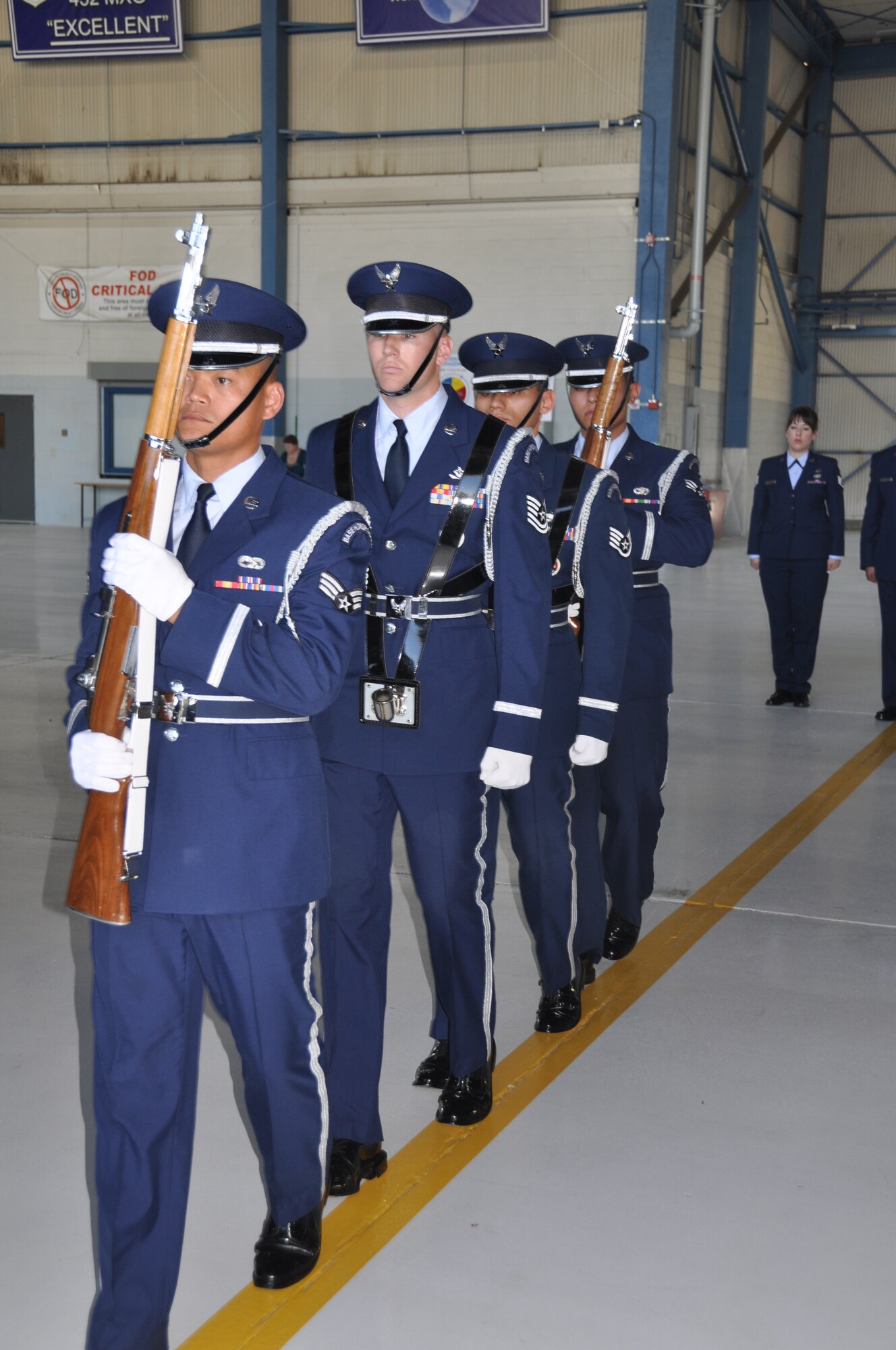 Col. Samuel C. Mahaney takes command of the 452nd Air Mobility Wing, March Air Reserve Base, Calif. from Major General Mark A. Kyle, commander, 4th Air Force on August 4. Airmen assigned to the Base Honor Guard present arms during the
base change of command ceremony. (U.S. Air Force photo by Senior Airman Isis Ponce)
