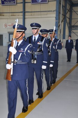 Col. Samuel C. Mahaney takes command of the 452nd Air Mobility Wing, March Air Reserve Base, Calif. from Major General Mark A. Kyle, commander, 4th Air Force on August 4. Airmen assigned to the Base Honor Guard present arms during the
base change of command ceremony. (U.S. Air Force photo by Senior Airman Isis Ponce)