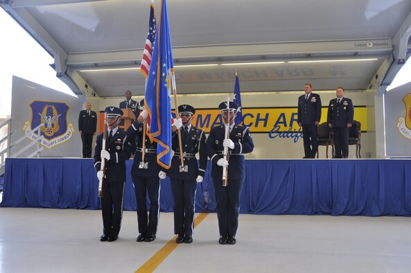 Col. Samuel C. Mahaney takes command of the 452nd Air Mobility Wing, March Air Reserve Base, Calif. from Major General Mark A. Kyle, commander, 4th Air Force on August 4. Airmen assigned to the Base Honor Guard present arms during the base change of command ceremony. (U.S. Air Force photo by Senior Airman Isis Ponce)