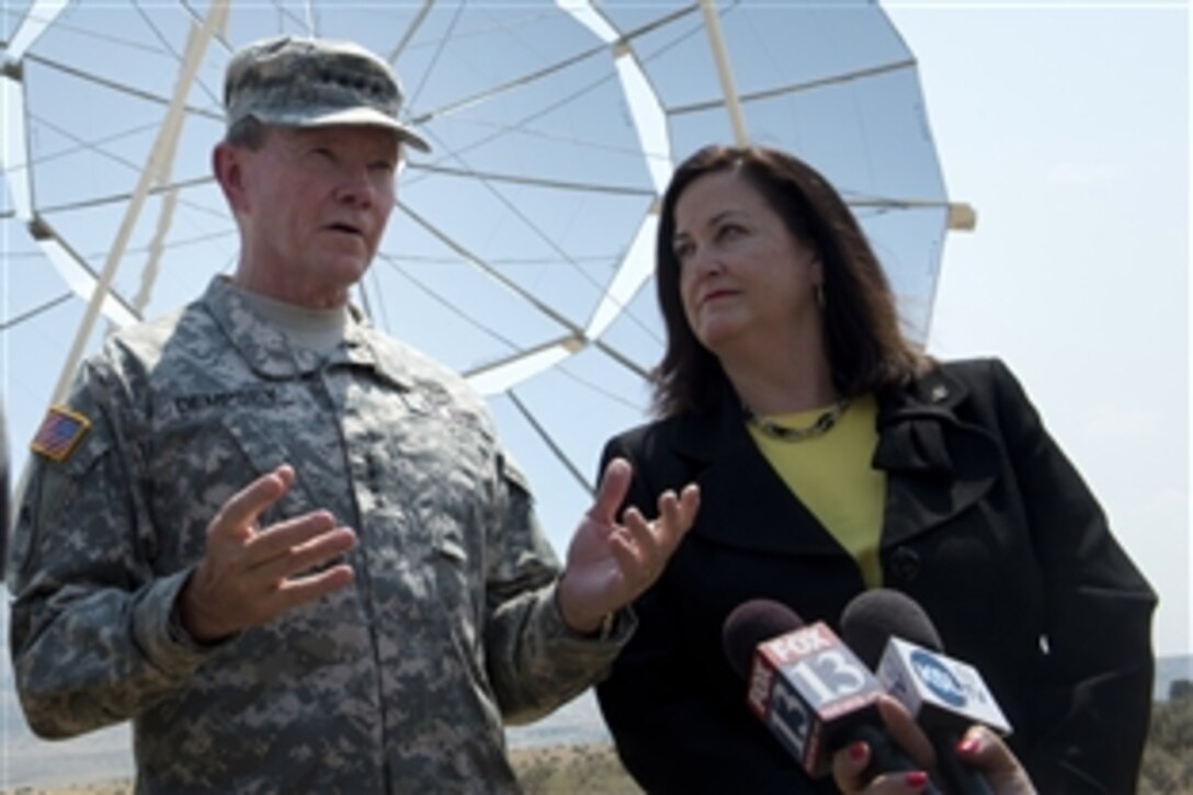 Army Gen. Martin E. Dempsey, chairman of the Joint Chiefs of Staff, and Katherine Hammack, assistant secretary of the Army for installations, energy and environment, address questions after a ground-breaking ceremony for a renewable energy farm at Tooele Army Depot, Utah, Aug. 17, 2012.