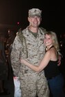 Capt. Robert Preston, an MV-22B pilot with Marine Medium Tiltrotor Squadron 365, and his girlfriend, Misty Kaplaski, reunite after having not seen each other for seven months, Aug. 1. The squadron's homecoming was celebrated at the squadron's flight line aboard Marine Corps Air Station New River, and featured a disk jockey providing music for the adults and inflatables for the children.
