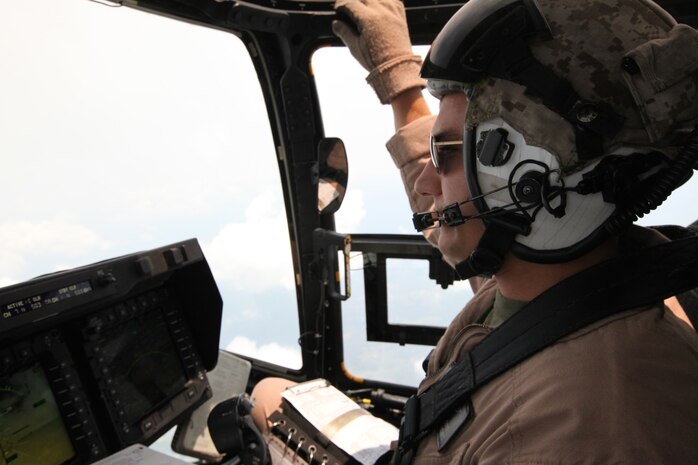 Capt. Matthew Wilckens, Marine Aircraft Group 26 special projects officer, pilots an MV-22B Osprey during a demonstration for Japanese officials, Aug. 3. The Marines of MAG-26 and Marine Medium Tiltrotor Squadron 266 demonstrated to the Japanese officials how safe Ospreys are, as well as their capabilities.
