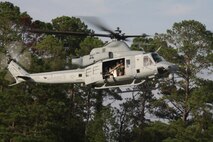 One of Marine Light Attack Helicopter Squadron 269's Hueys takes off from a confined area landing. HMLA0269 Marines conducted training to help the Marines gain proficiency with the latest model of the UH-1, the UH-1Y, Aug. 9.