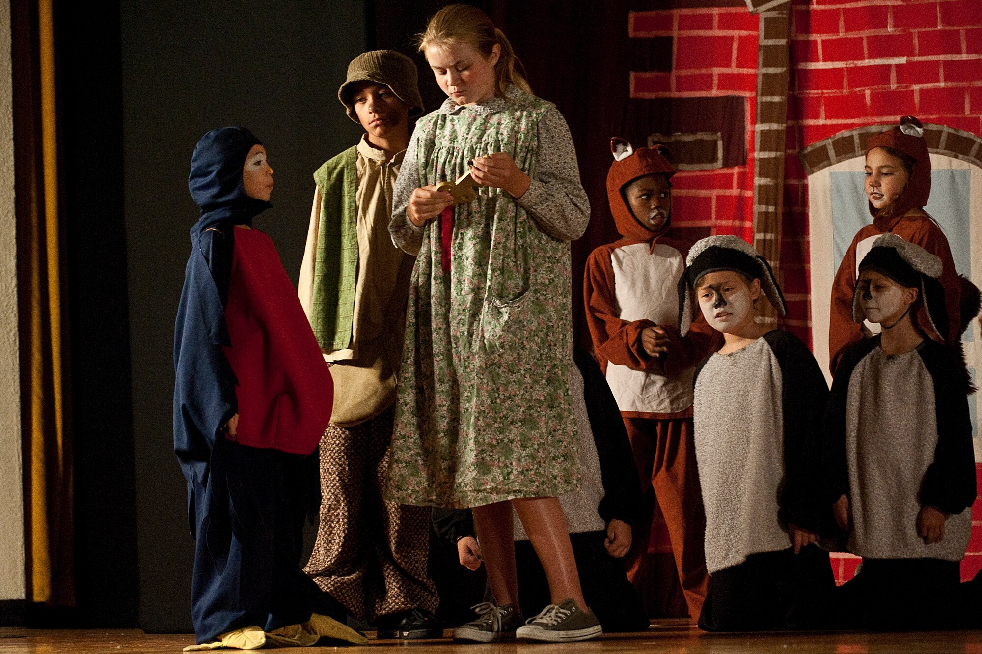 Amber Docter, portraying Robin Redbreast, and Anna Lee, portraying Mary Lennox, perform a scene during the Missoula Children's Theatre rendition of "The Secret Garden" at the base theater Aug. 18, 2012, at Nellis Air Force Base, Nev. Songs performed during the performance included "Bugs that rock", "Moor Folk", "Canadian Geese", "Fireflies", and "The Secret Garden.". (U.S. Air Force photo by Staff Sgt. Christopher Hubenthal)