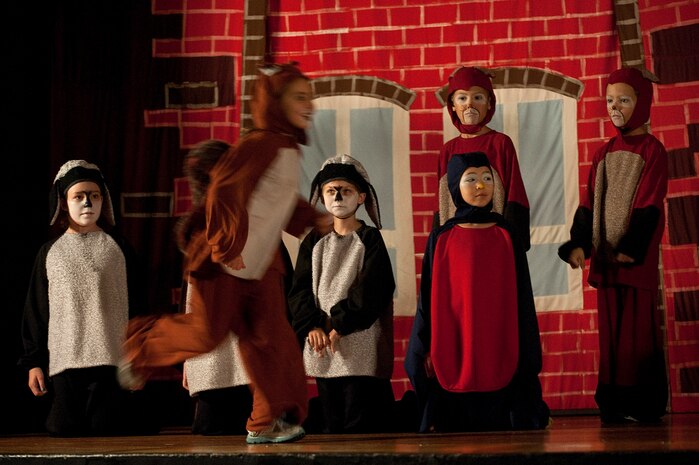 Military family members perform during the Missoula Children's Theatre rendition of "The Secret Garden" at the base theater Aug. 18, 2012, at Nellis Air Force Base, Nev. The Missoula Children's Theatre provided a week-long program for military family members at Nellis AFB, with a final performance on the sixth day of residency. (U.S. Air Force photo by Staff Sgt. Christopher Hubenthal)