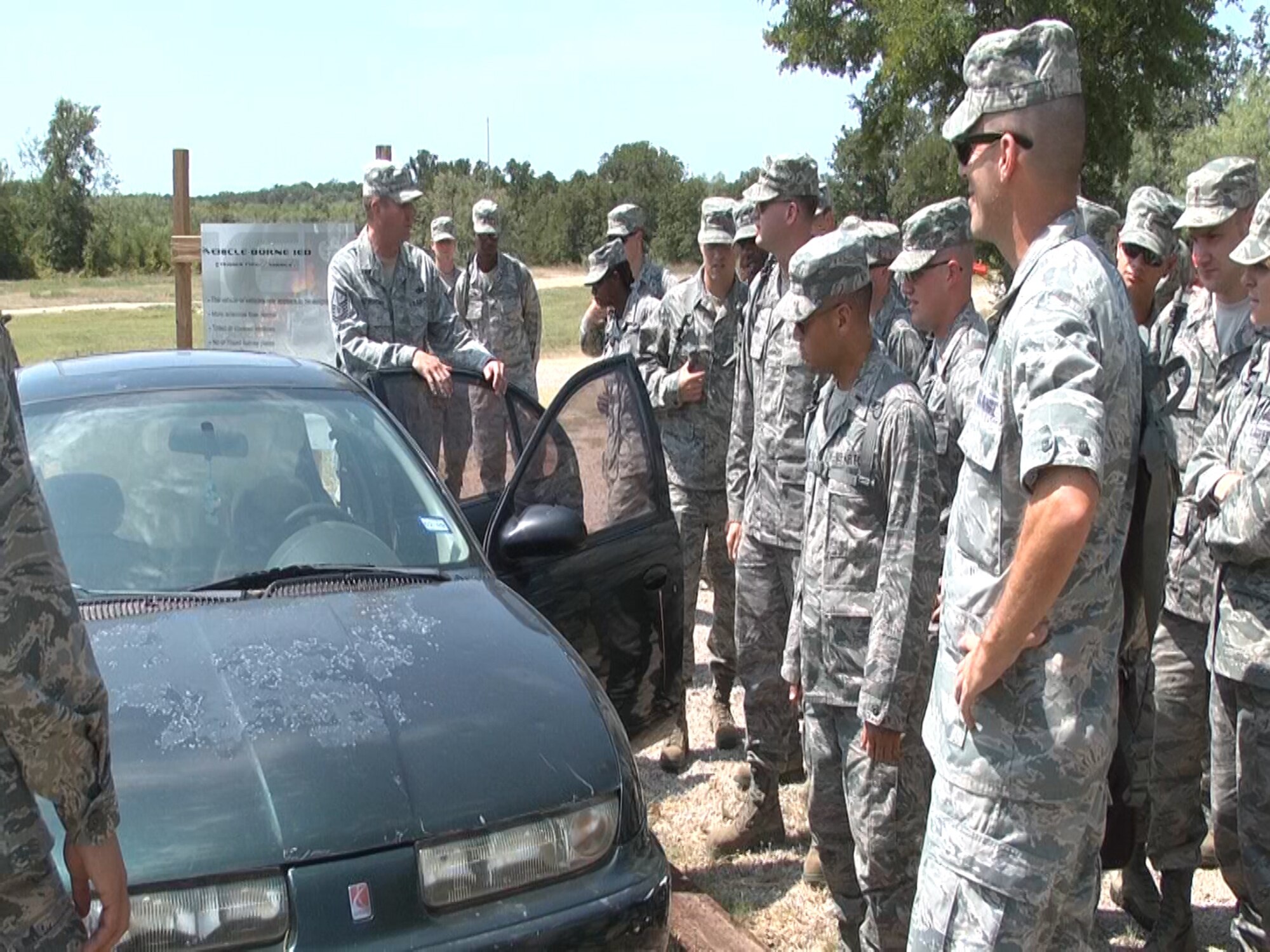 The candidates view an automotive improvised explosive device at Fort Wolters in Mineral Wells, Texas. The focus of this part of the tour was the exposure to total force integration through Patriot Defender deployment training. They took training courses that included a land navigation, IED, and counter insurgency classes on Monday and Tuesday, August 6 and 7, 2012. (U.S. Air Force photo/SrA Jeremy Roman)