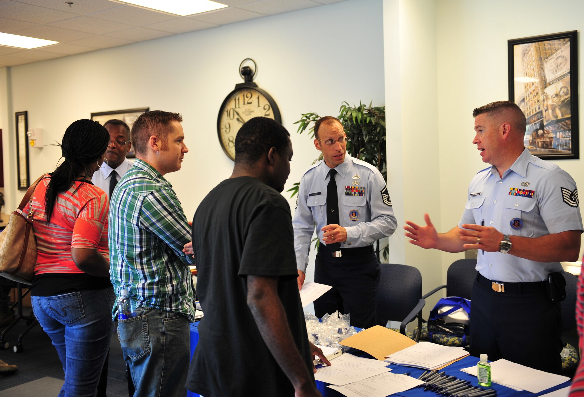 Moody and Dobbins Air Force Reserve recruiters speak to Individual Ready Reserve members during an IRR muster at Moody Air Force Base, Ga., Aug. 18, 2012. IRR members were given the opportunity to speak to a recruiter about joining the Air Force Reserve and the benefits the Reserve or Guard offers. (U.S. Air Force photo by Staff Sgt. Stephanie Mancha/ Released)