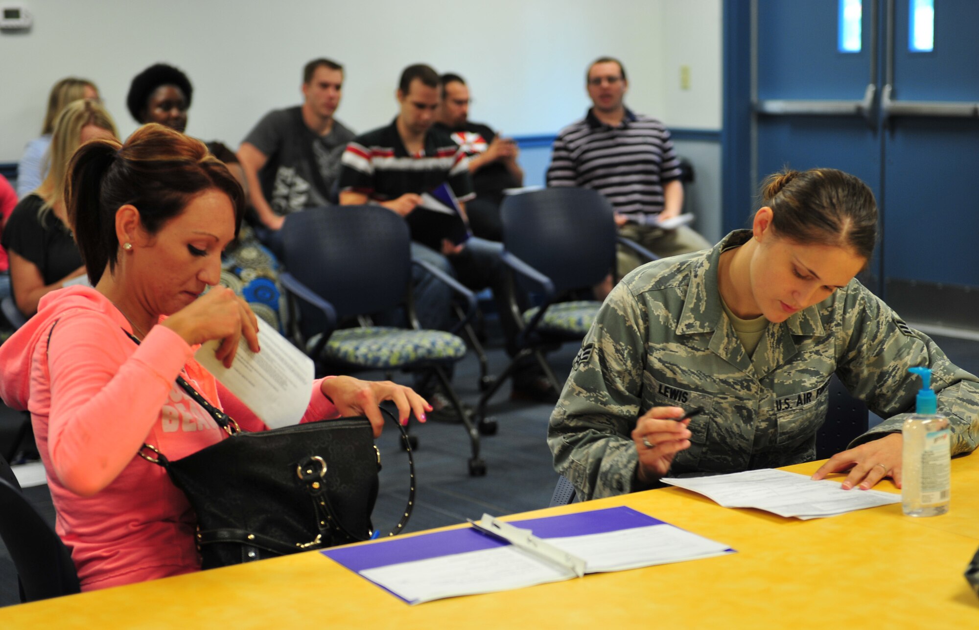 U.S. Air Force Senior Airman Jennifer Lewis, 23d Aerospace Medicine Squadron aerospace medical technician, performs a medical screening on Elizabeth Frymier during the 2012 Individual Ready Reserve (IRR) Muster at Moody Air Force Base, Ga., Aug. 18, 2012.  The IRR Muster is one of three continuous Pre-trained Individual Manpower screening programs mandated by law and managed by the Air Reserve Personnel Center at Buckley AFB, Colorado used to enhance the readiness and reporting of this vital Strategic Reserve asset. (U.S. Air Force photo by Staff Sgt. Stephanie Mancha/ Released)