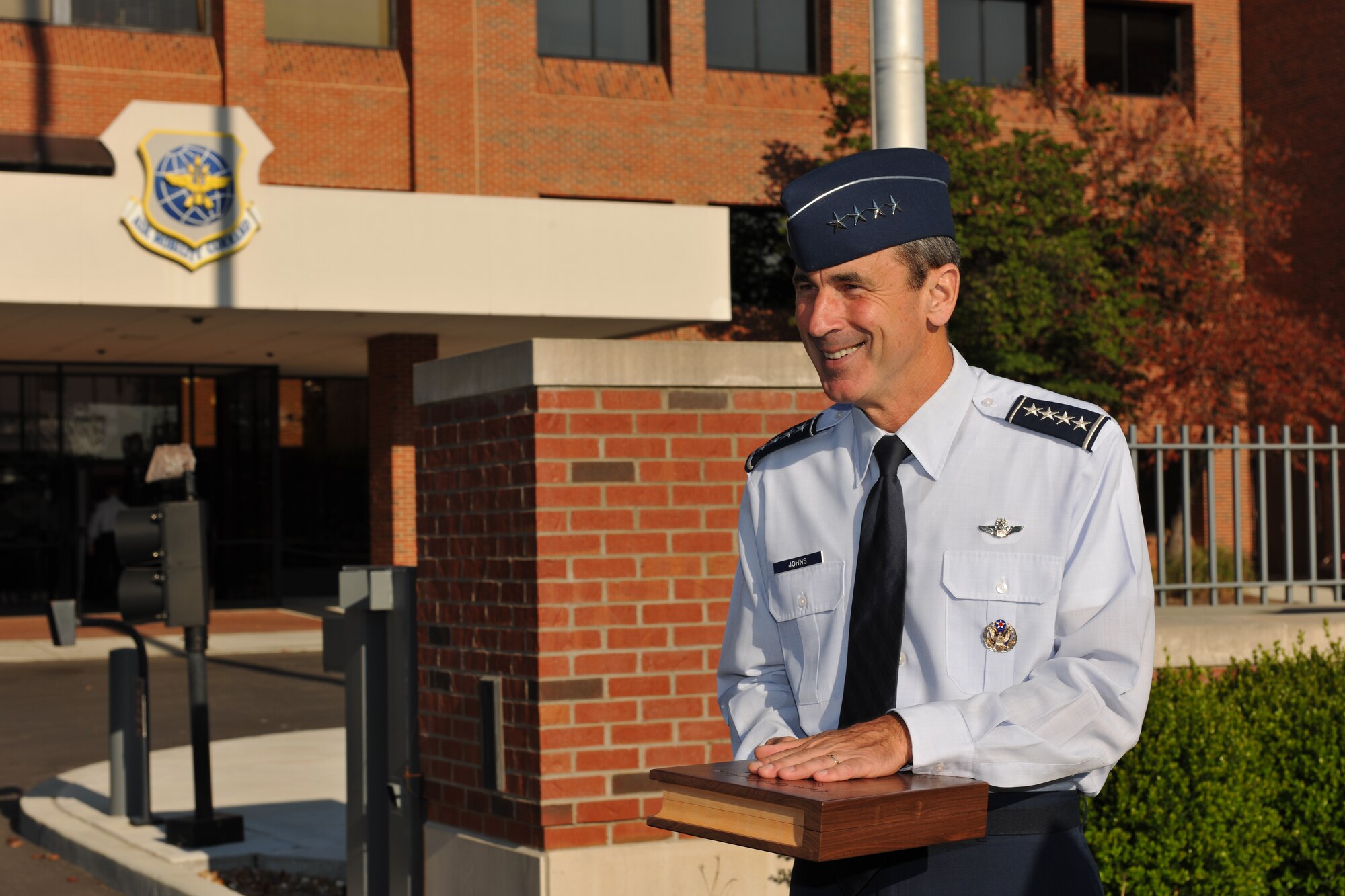 Gen. Raymond Johns, Air Mobility Command commander, was surprised to be greeted by more than 250 Airmen who saluted him as he arrived at Headquarters AMC the morning of Aug. 20, 2012. The enlisted Airmen of AMC will present Johns the highest honor an enlisted person can bestow upon a leader Nov. 28, 2012. (U.S. Air Force photo/Jennifer Geggus)