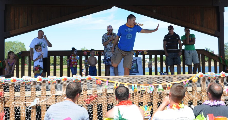 WHITEMAN AIR FORCE BASE, Mo. -- Team Whiteman members compete in a dance contest during the Atomic Luau Aug. 17. The Atomic Luau had games and contest going on throughout the day with the winners winning gift cards and other prizes. (U.S. Air Force photo/Airman 1st Class Bryan Crane)(Released)