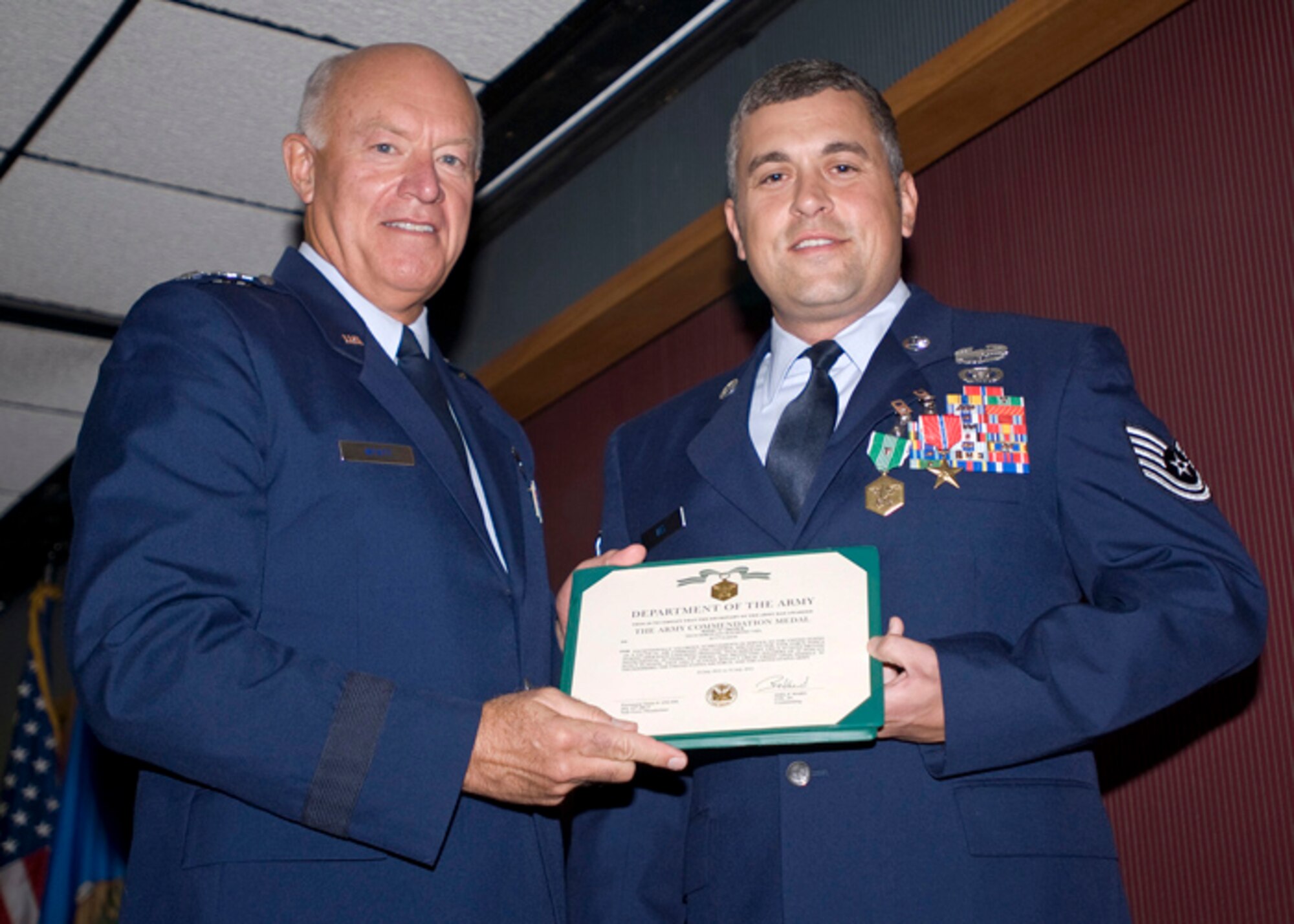 Tech. Sgt. Raymond Viel, 146th Air Support Operations Squadron, is presented the Bronze Star Medal, the Army Commendation Medal with Valor and the Air Force Combat Action Medal by Lt. Gen. Harry M. Wyatt III, Director Air National Guard, on August 18, 2012, he supported of the 1st Battalion, 179th Regiment, 45th Infantry Brigade Combat Team while engaged in ground combat against hostile forces in service to the United States Army resulting in killing seven insurgents and fatally wounding one High Value Individual.  Tech. Sgt. Viel was deployed to Laghman Province, Afghanistan from July 2011 through March 2012.   (U.S. Air Force Photo by Tech. Sgt. Roberta A. Thompson) (Released)