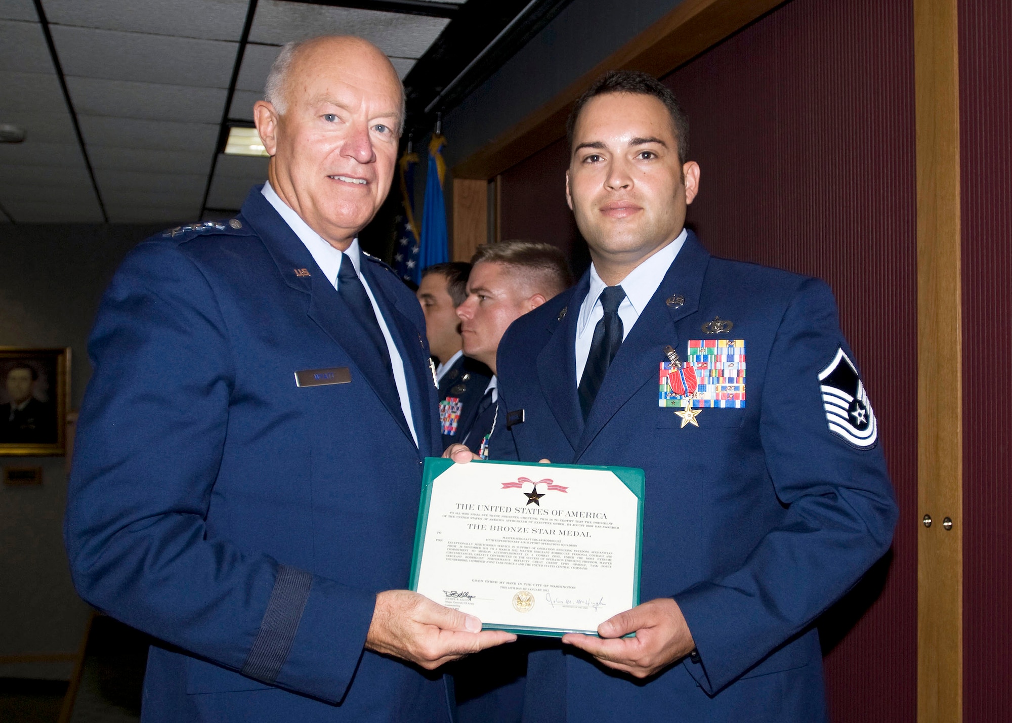 Master Sgt. Edgar Rodriguez, 146th Air Support Operations Squadron, is presented the Bronze Star Medal by Lt. Gen. Harry M. Wyatt III, Director Air National Guard, on August 18, 2012 for his actions as the Brigade Tactical Air Control Party Noncommissioned Officer in Charge for the 45th Infantry Brigade Combat Team while engaged in ground combat against hostile forces.  Master Sgt. Rodriquez was deployed from November 30, 2011 through March 6, 2012.  (U.S. Air Force Photo by Tech. Sgt. Roberta A. Thompson) (Released)