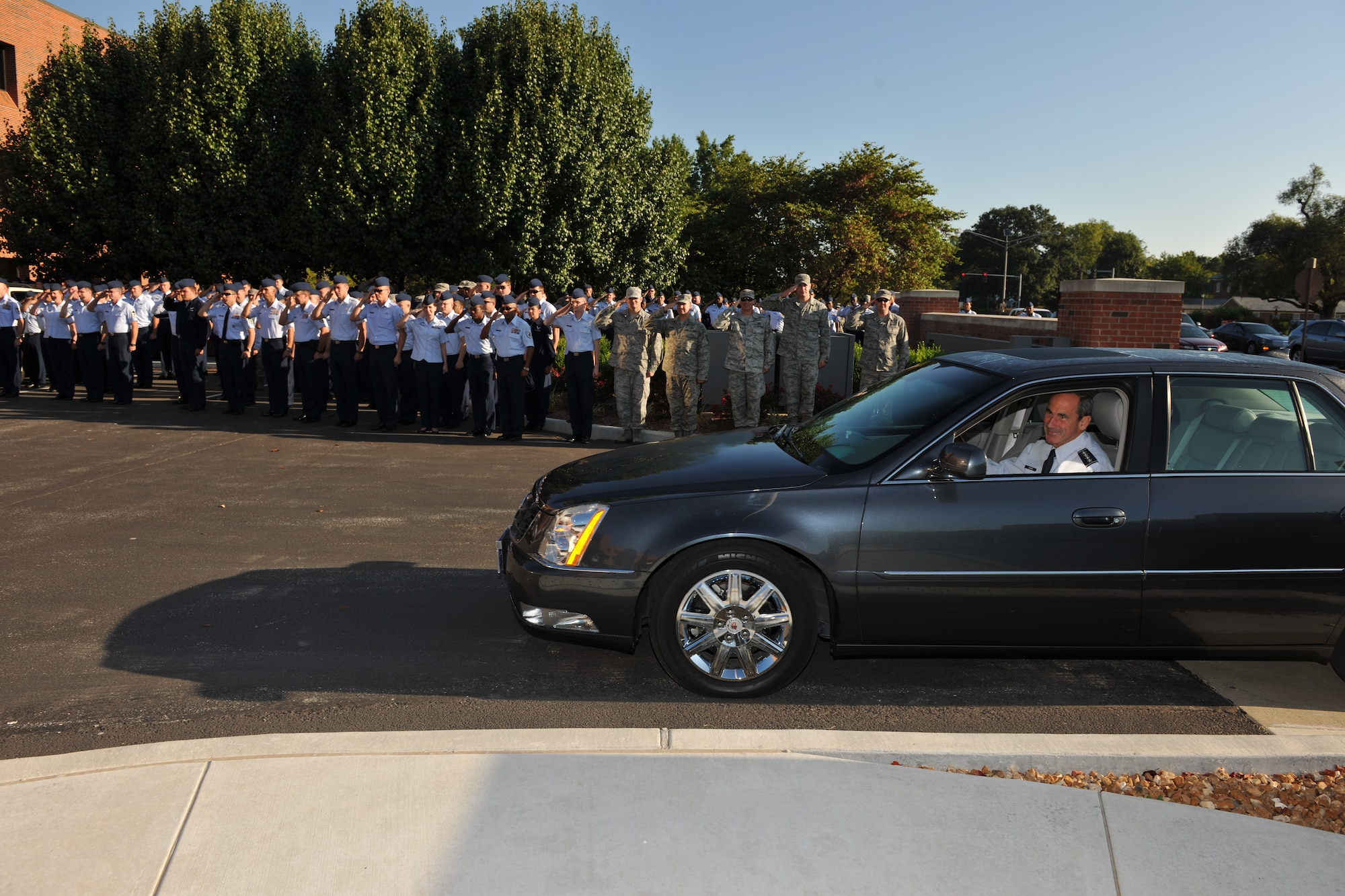 Gen. Raymond Johns, Air Mobility Command commander, received a surprise greeting the morning of Aug. 20, 2012, with more than 250 Mobility Airman saluting him as he arrived at the Headquarters AMC building at Scott Air Force Base, Ill. The reason for the surprise was to announce that John’s nomination for an Order of the Sword was confirmed. (U.S. Air Force photo/Jennifer Geggus) 