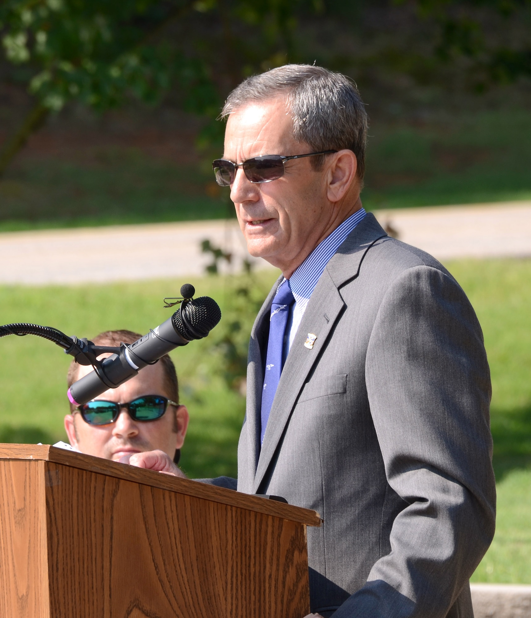 Air Force Col. (ret) Lee Ellis speaks to members of the Honorary Commanders Association during a POW/MIA ceremony at Dobbins Air Reserve Base, Ga. on Aug 16. The 2012 HCA visited Dobbins Air Reserve Base as part of their year-long introduction to the military.  (U.S. Air Force photo/Brad Fallin)