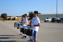 The Randolph High School band drumline plays the cadence as the band practices in the early morning heat at Randolph, Aug. 14. The band is learning fundamentals of drill to prepare for the upcoming marching season. (U.S. Air Force photo by Rich McFadden) 