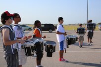The Randolph High School band drumline plays the cadence as the band practices in the early morning heat at Randolph,  Aug. 14. The band is learning fundamentals of drill to prepare for the upcoming marching season. (U.S. Air Force photo by Rich McFadden) 