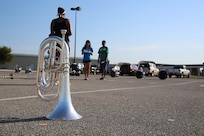 A Randolph High School band cornet sits on the practice ground as the band prepares to practice in the early morning heat at Randolph, Aug. 14. The band is learning fundamentals of drill to prepare for the upcoming marching season. (U.S. Air Force photo by Rich McFadden) 