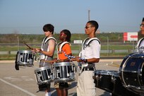The Randolph High School band drumline plays the cadence as the band practices in the early morning heat at Randolph, Aug. 14. The band is learning fundamentals of drill to prepare for the upcoming marching season. (U.S. Air Force photo by Rich McFadden) 