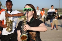 Stacia Jeors, Randolph High School band saxophone player, stands ready as the band practices in the early morning heat at the high school, Aug. 14. The band is learning fundamentals of drill to prepare for the upcoming marching season. (U.S. Air Force photo by Rich McFadden) 