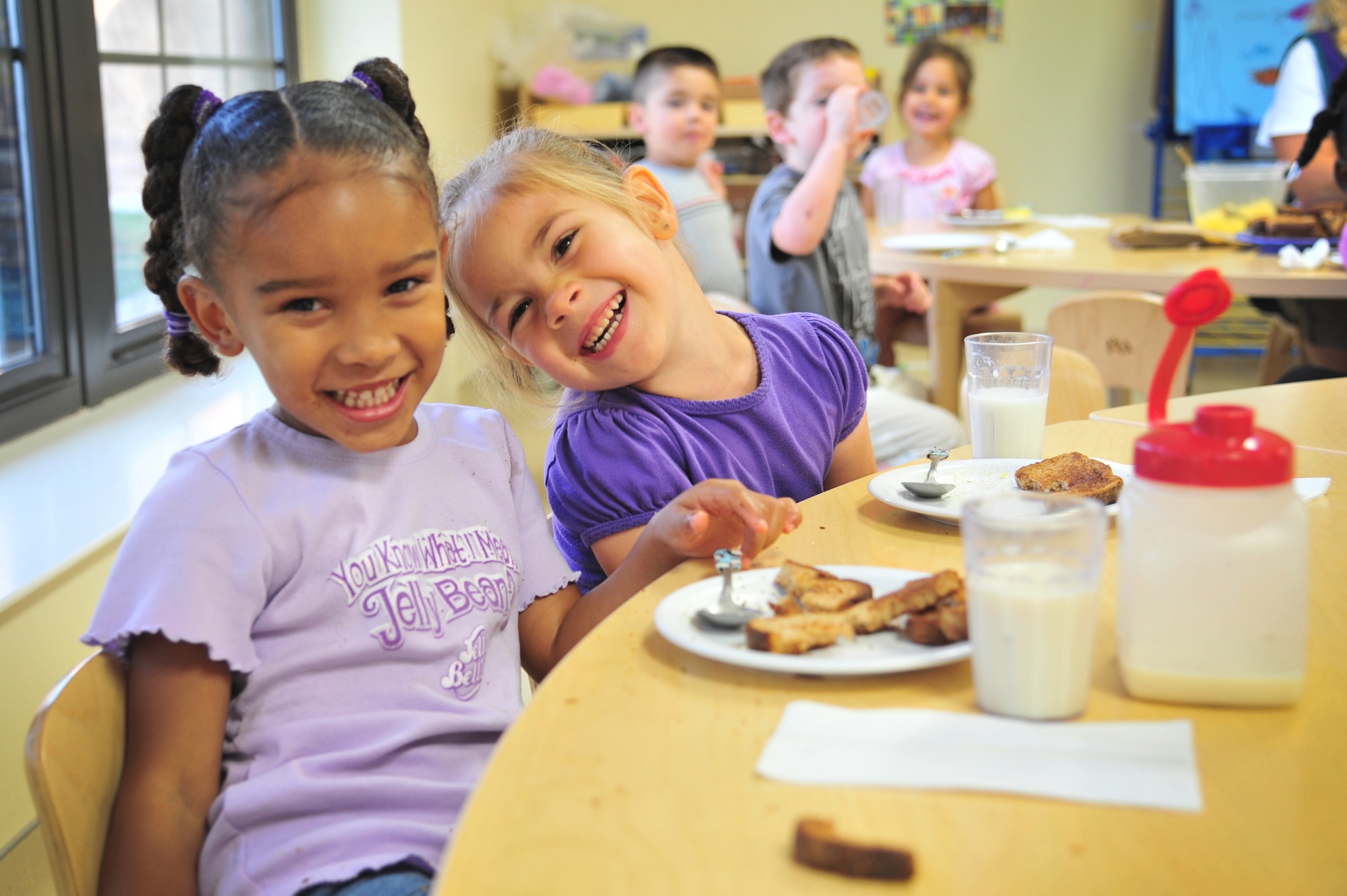 Children at the Child Development Center are given their daily breakfast in the facility at Cannon Air Force Base, N.M., Aug. 20, 2012. The CDCs provide care to children within the Cannon community and are accredited by The National Association for the Education of Young Children. (U.S. Air Force photo/Airman 1st Class Alexxis Pons Abascal)  