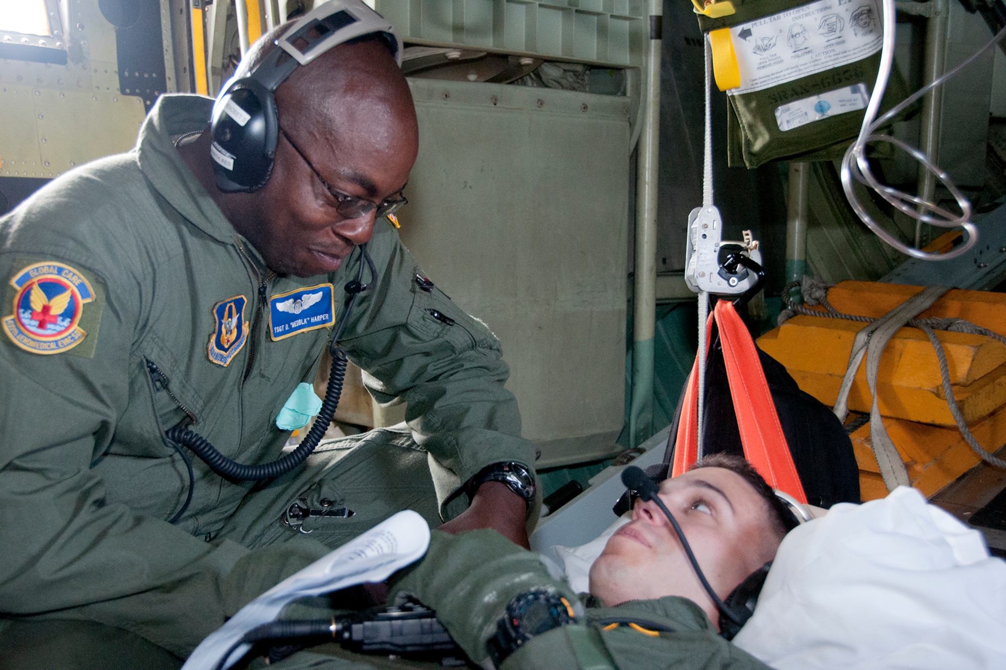 WESTOVER AIR RESERVE BASE, Mass. -- U.S. Air Force Tech. Sgt. Daryl Harper, 439th Aeromedical Evacuation Squadron (AES) aeromedical evacuation technician, checks a simulated patient’s vital signs played by U.S. Air Force Senior Airman Jonathan Wells, 439th AES aeromedical evacuation technician, during a quarterly readiness mission at Westover Air Reserve Base, Mass., Aug. 11, 2012. (U.S. Air Force photo/Staff Sgt. Megan Tomkins)