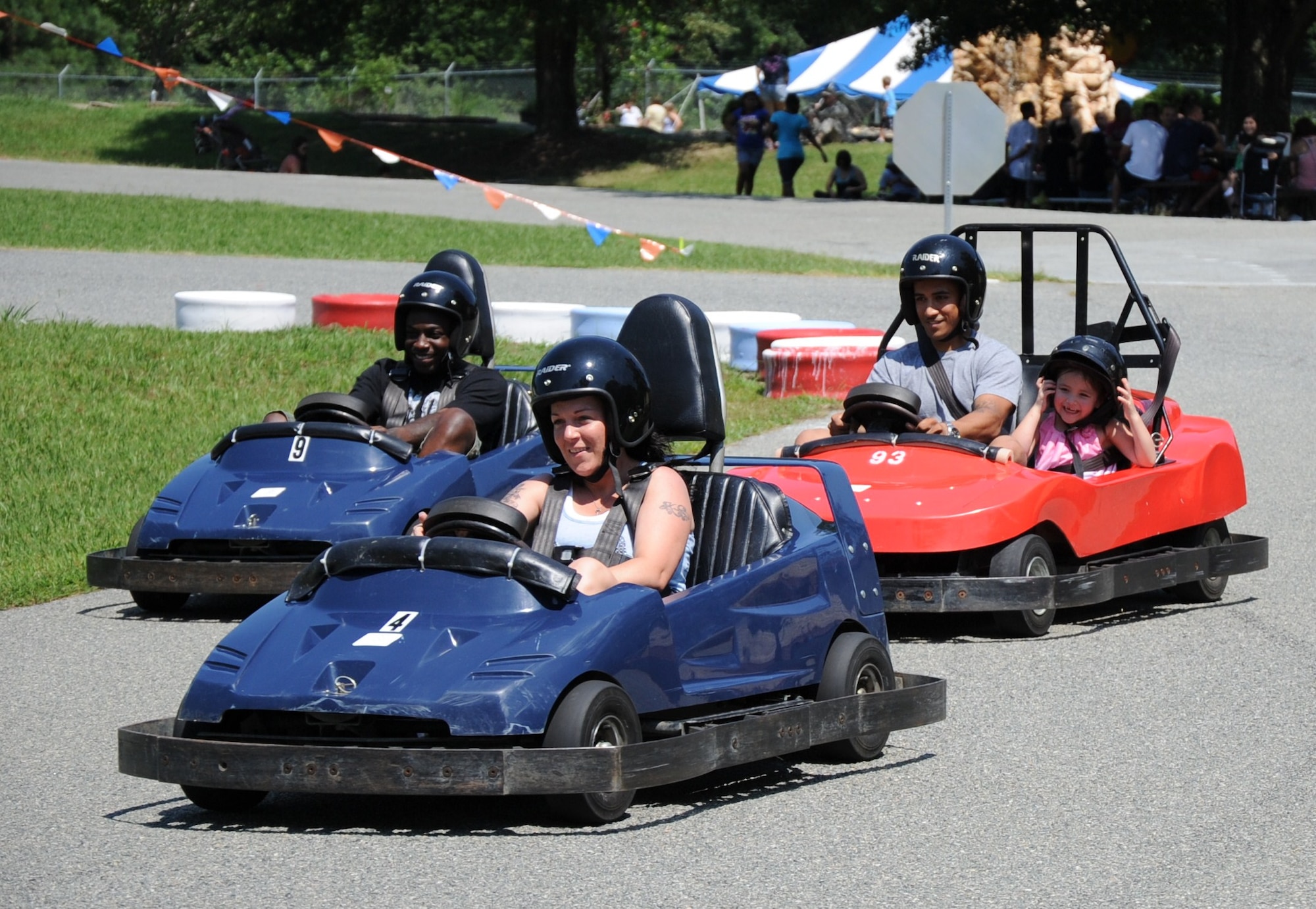 Soldiers and family members race around the go-kart track at the Fort Eustis mini-park Aug. 17, 2012. Visitors can speed around the track in a swift go-kart for 10 minutes for only $6 per person. (U.S. Air Force photo by Senior Airman Jason J. Brown/Released)