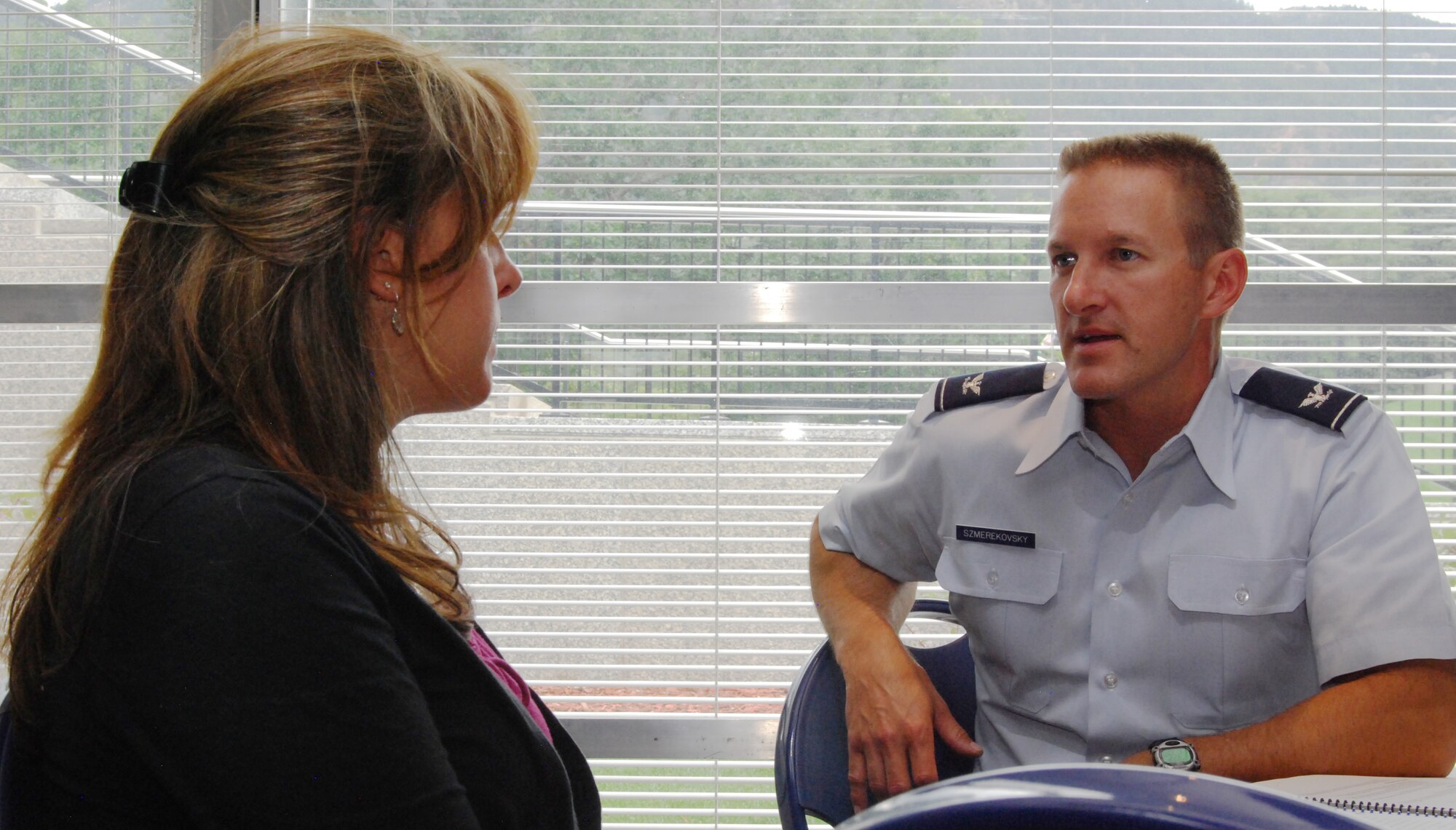 Col. Andy Szmerekovsky and Tina Erzen conduct a short mentoring session during a class on mentoring at the Air Force Academy Aug. 6, 2012. Szmerekovsky is the deputy director of assessment for the Academy's Engineering Mechanics Department. Erzen is assigned to the Commandant of Cadets' Honor Directorate. (U.S. Air Force photo/Don Branum)